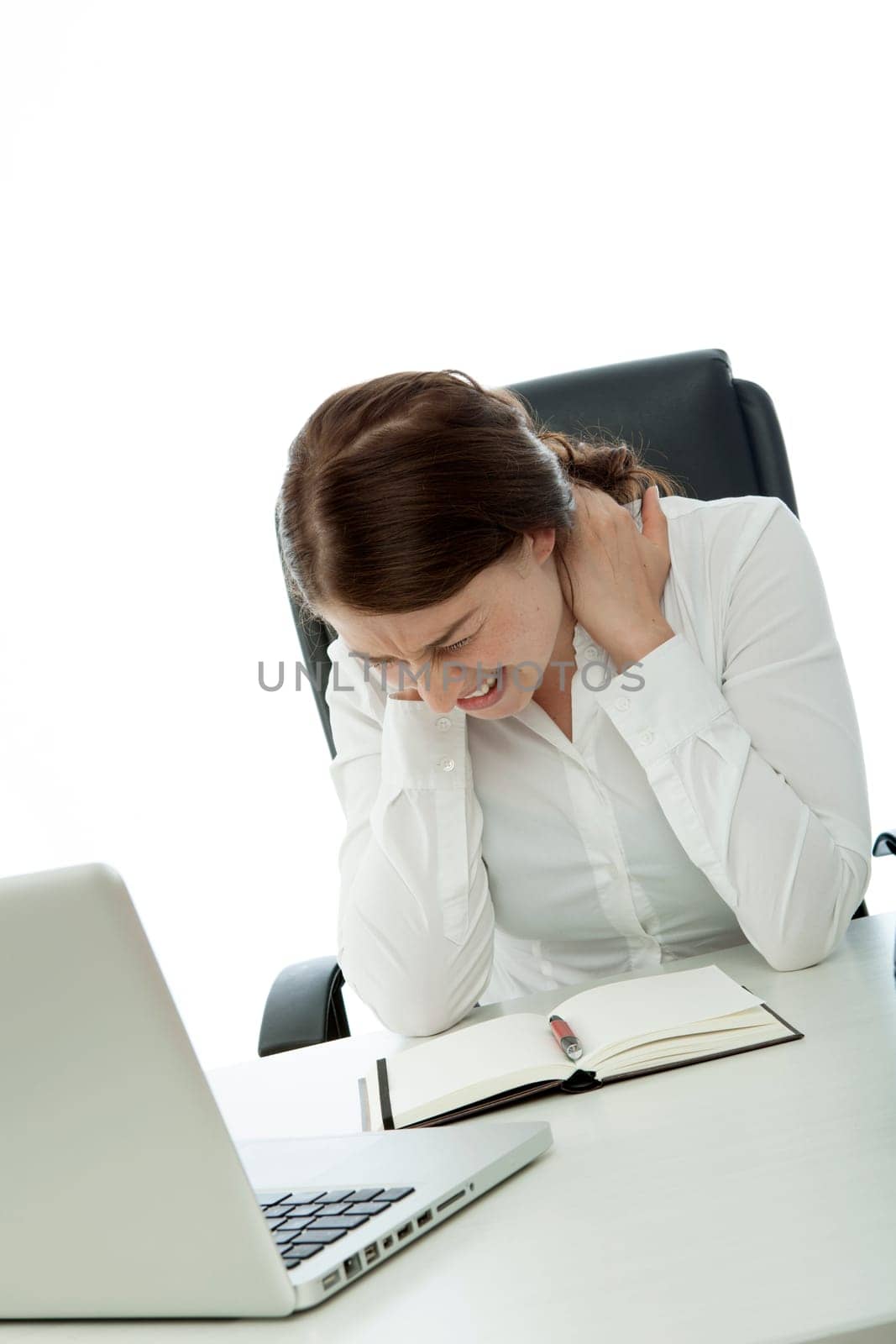 young brunette business woman neck pain on desk