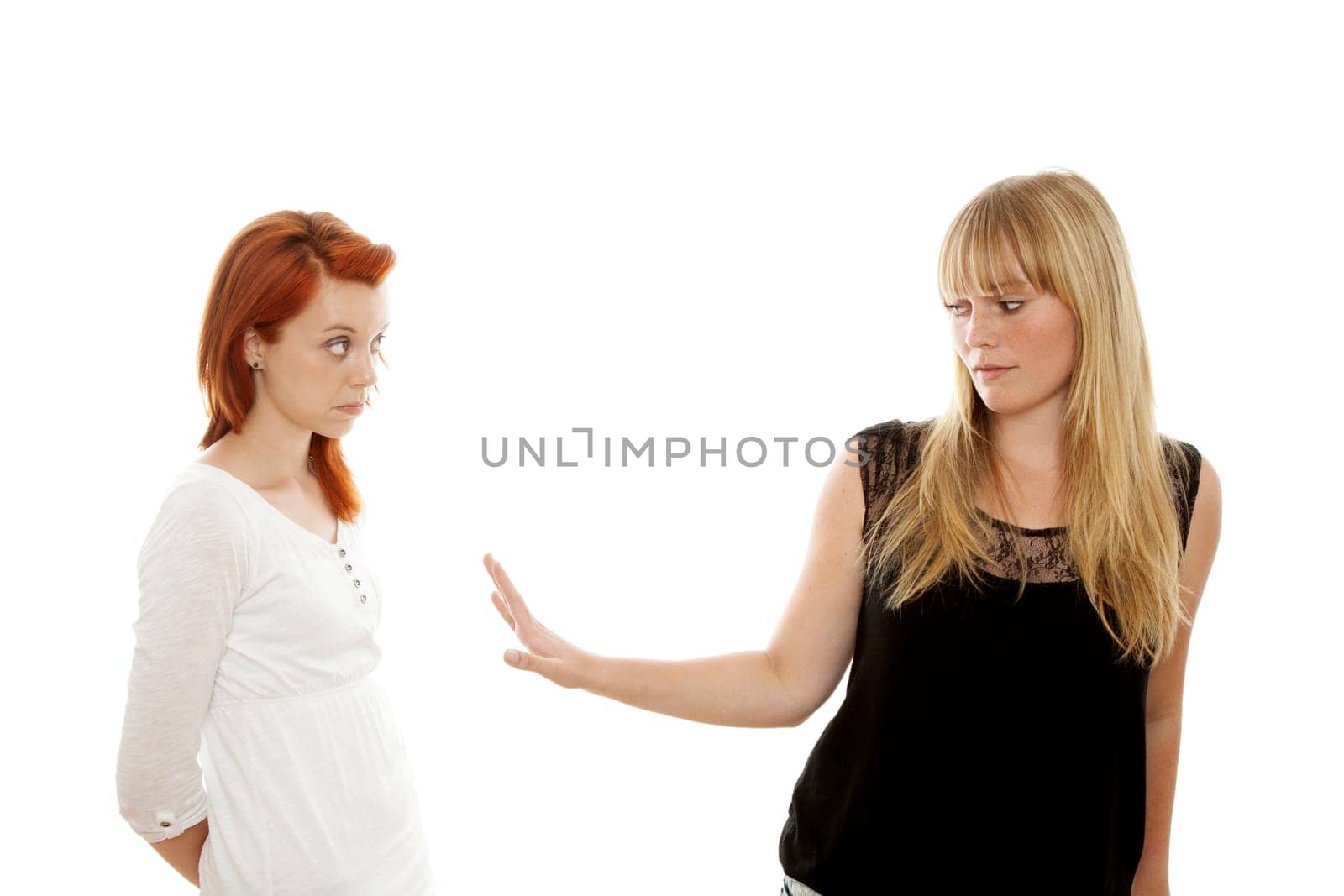 young beautiful red and blond haired girls in front of white background