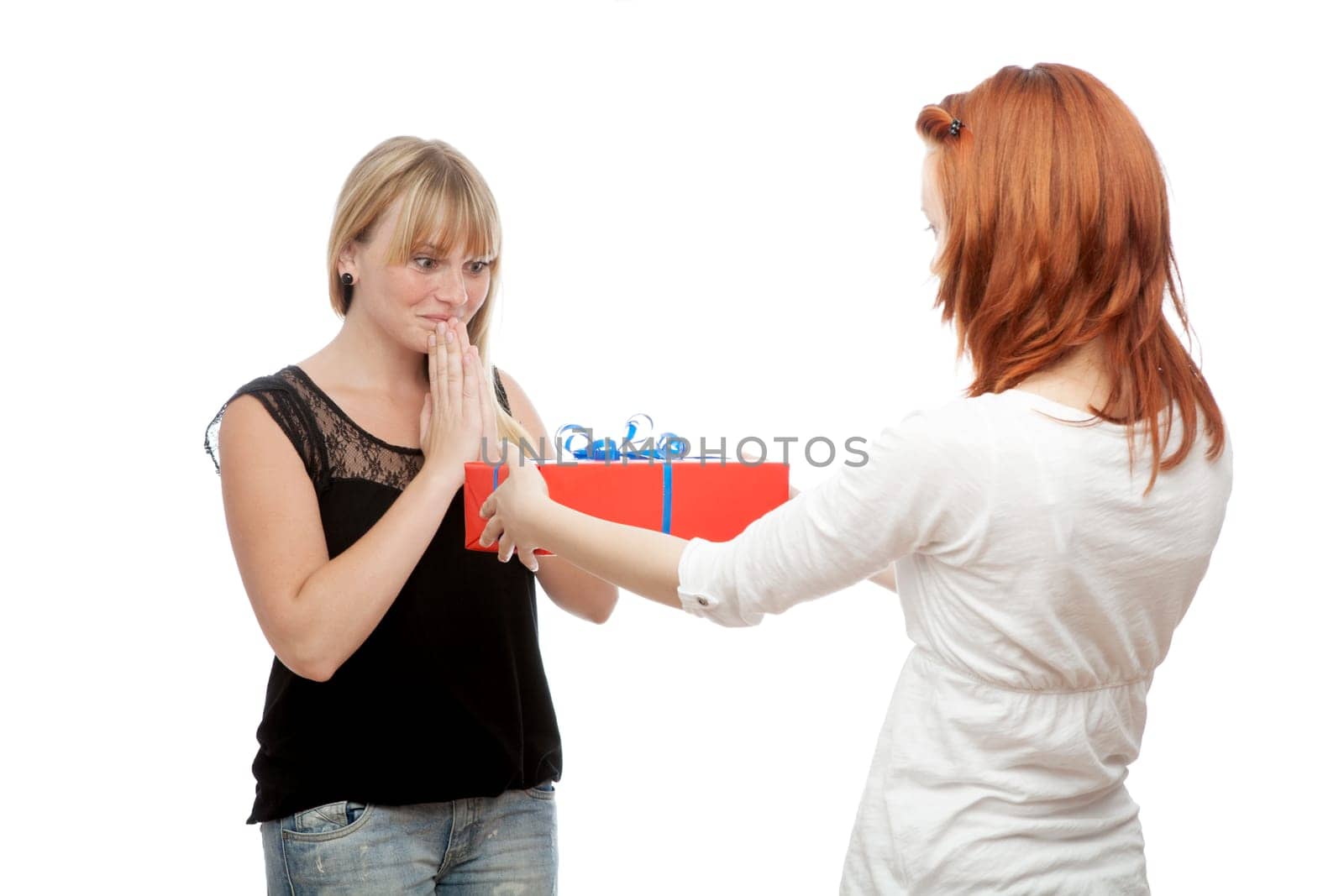 young beautiful red and blond haired girls in front of white background