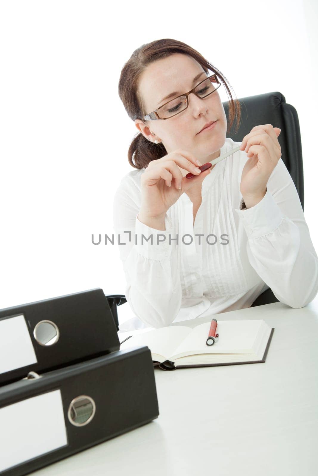 young brunette businesswoman with glasses file nail