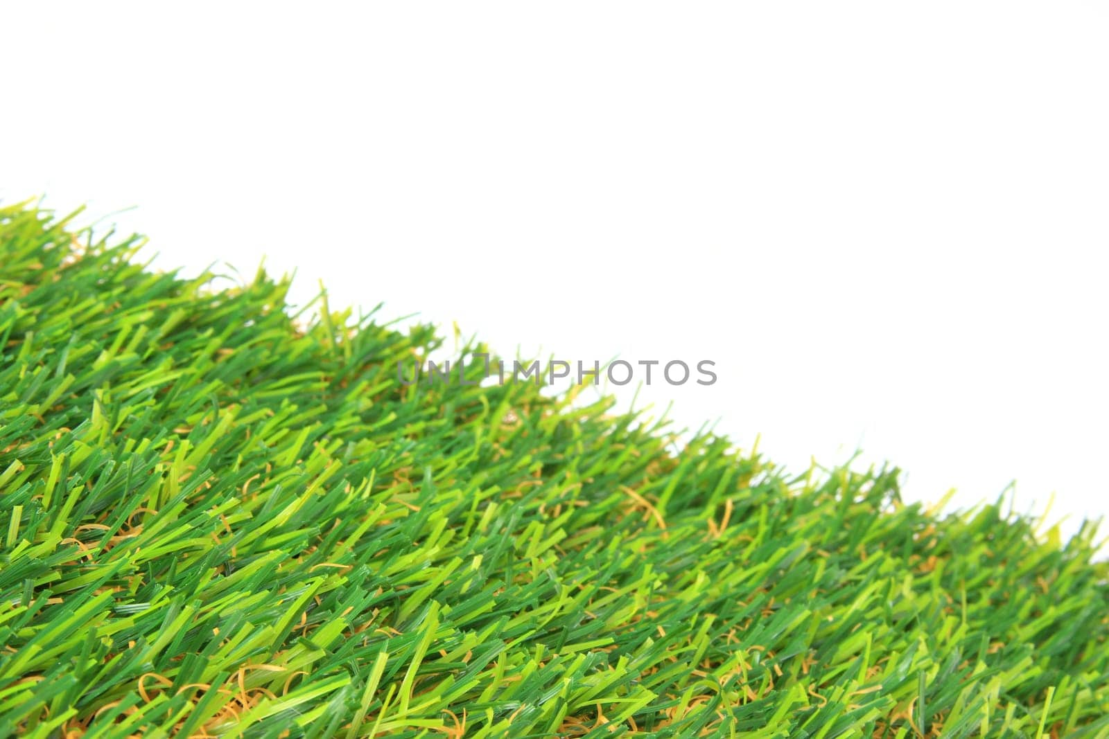 Artificial grass against a white background