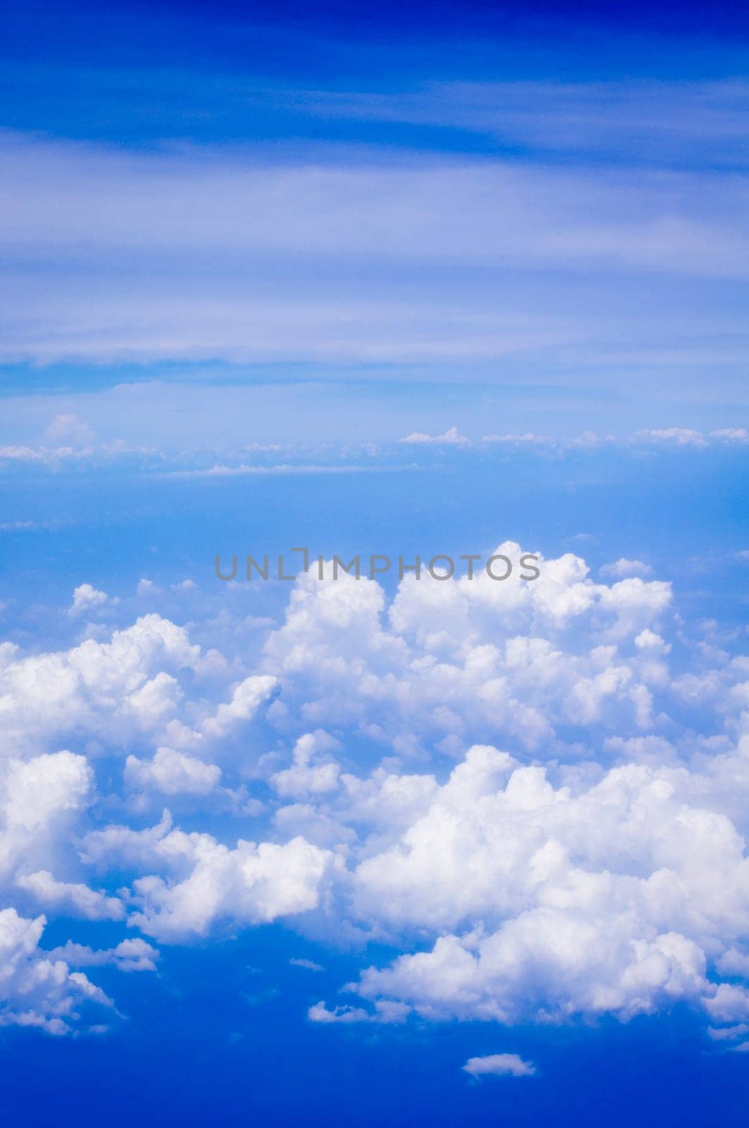 a view of sky, above of clouds.