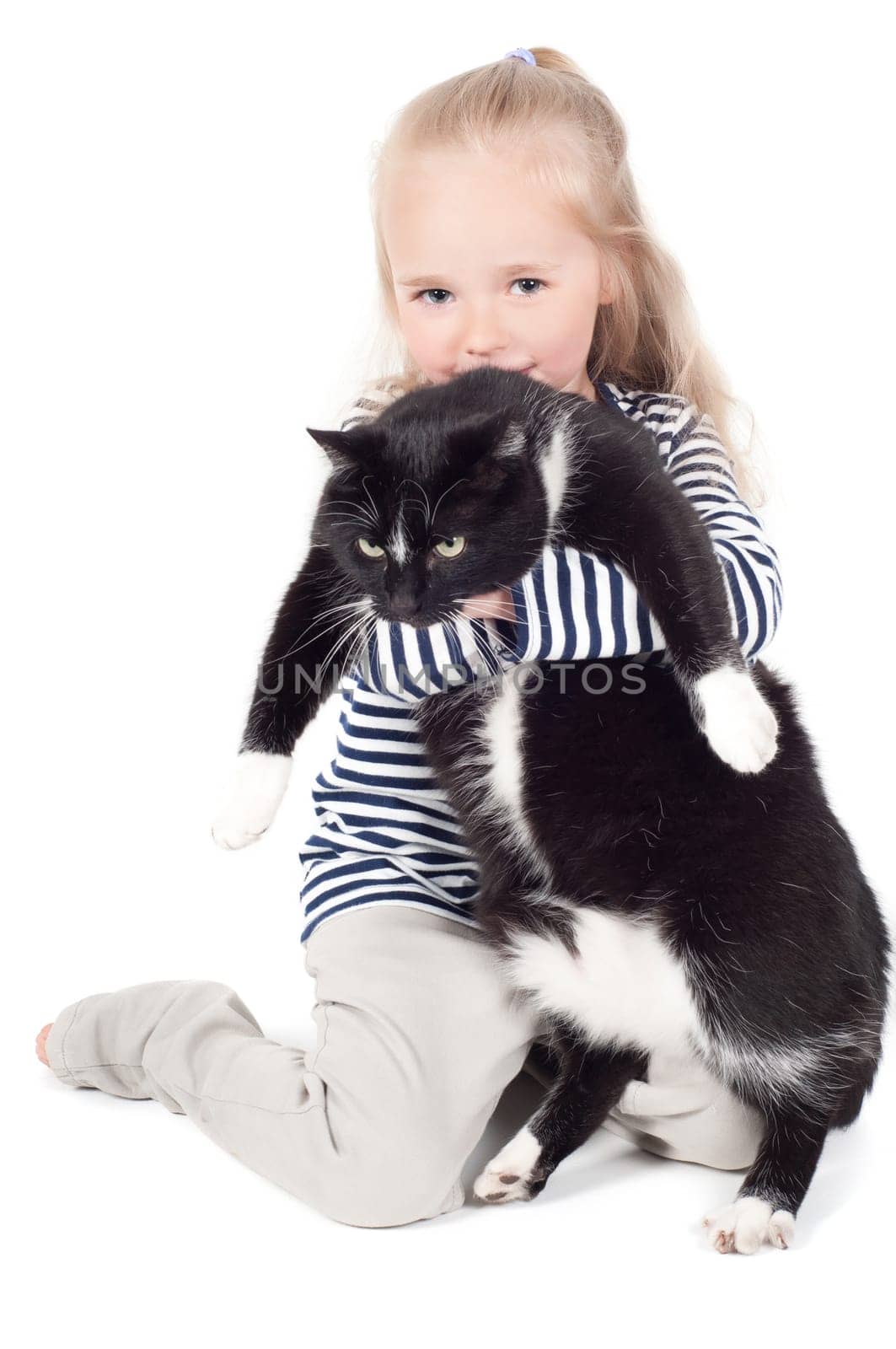 Shot of little cute girl with black cat in studio