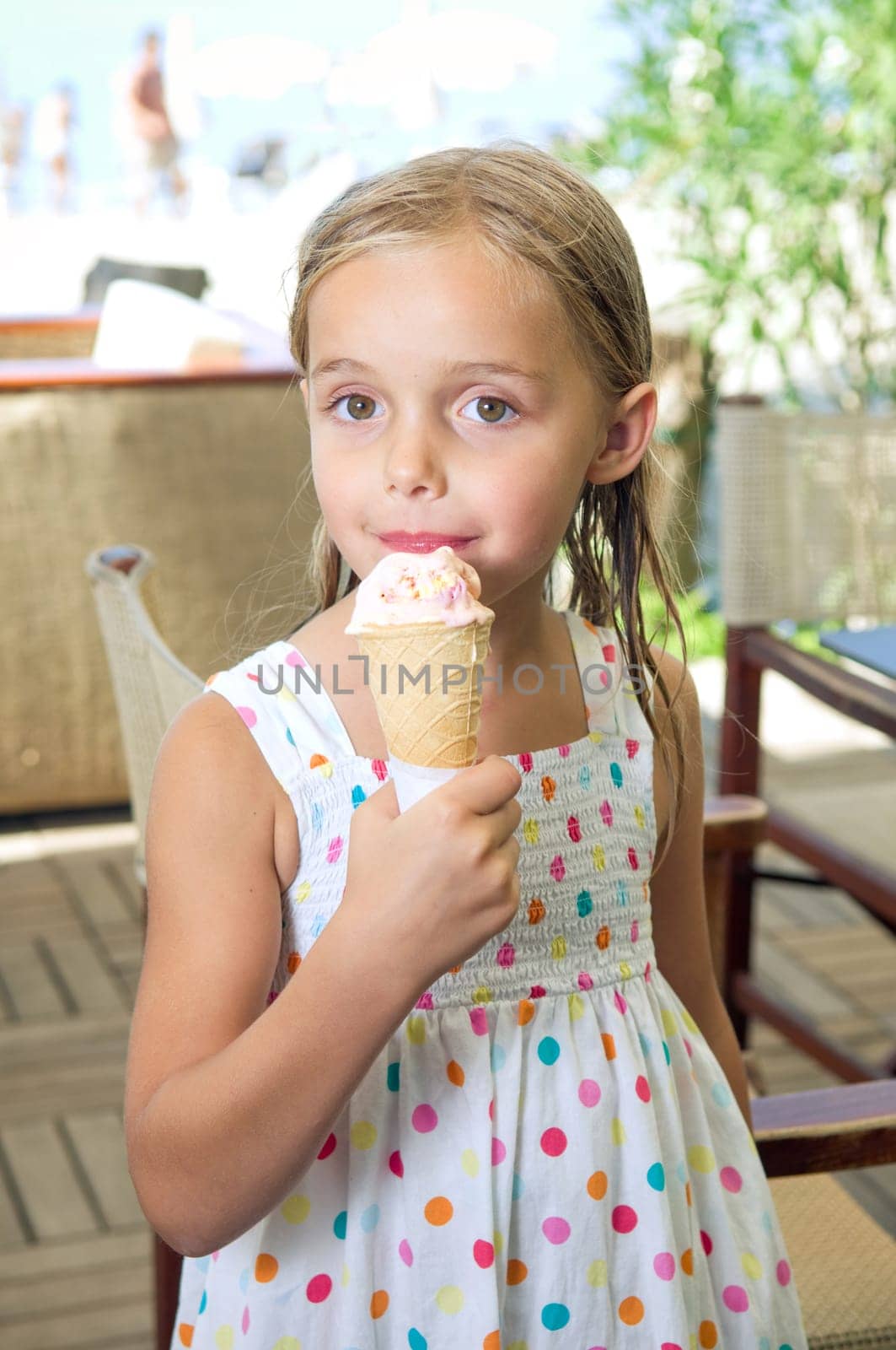 Cute little girl eating ice cream