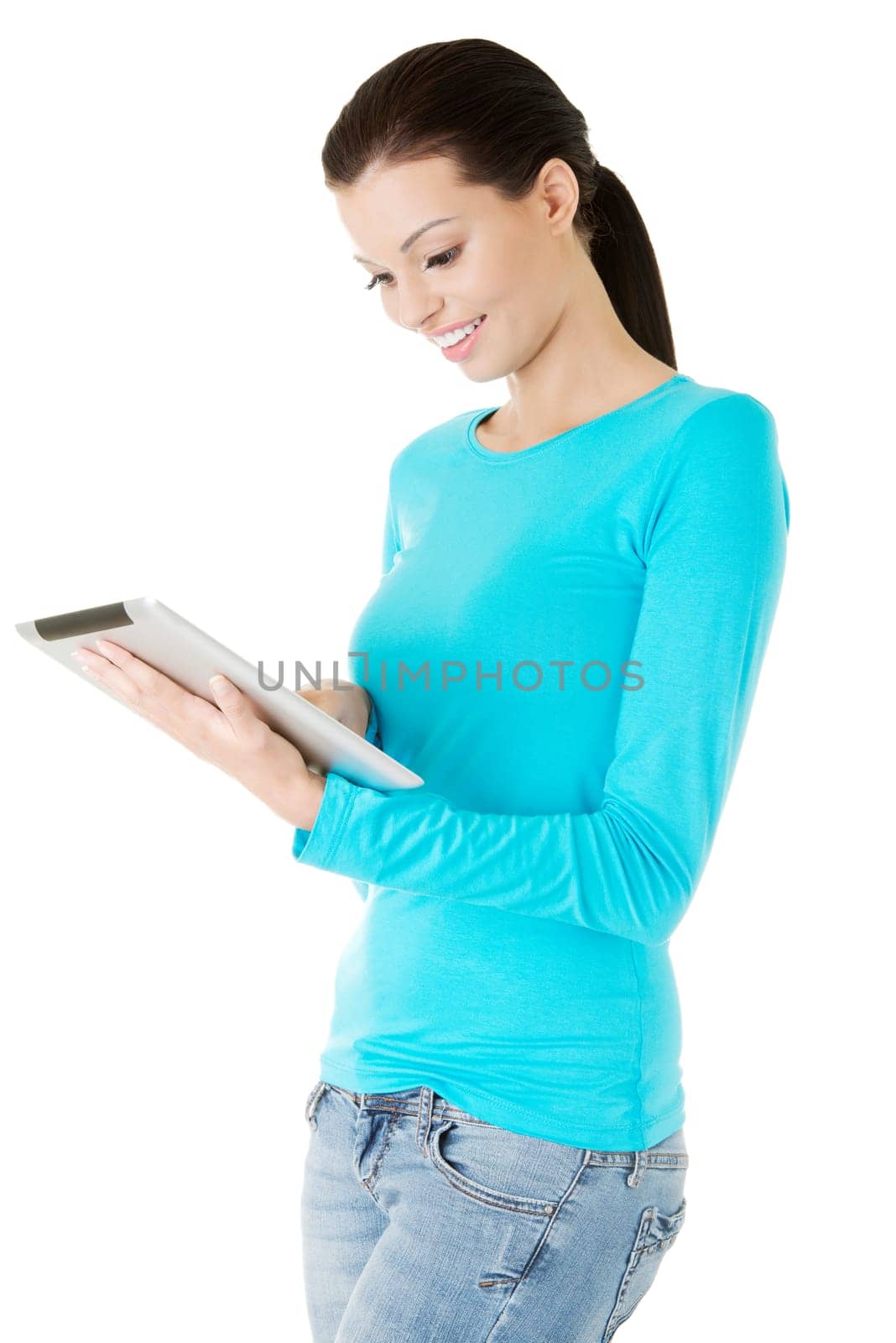 Young pretty woman working on tablet computer, isolated on white