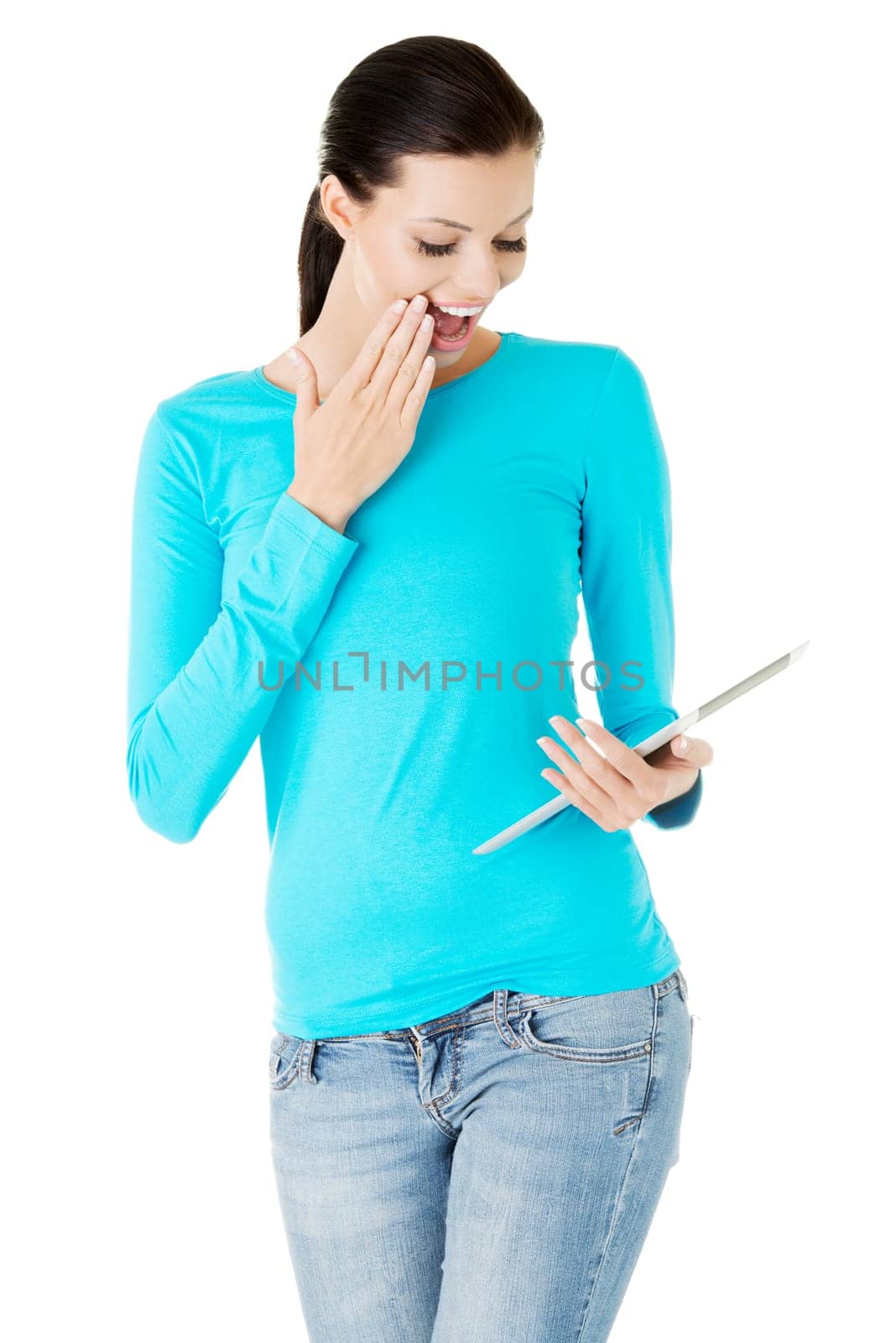 Young pretty woman working on tablet computer, isolated on white