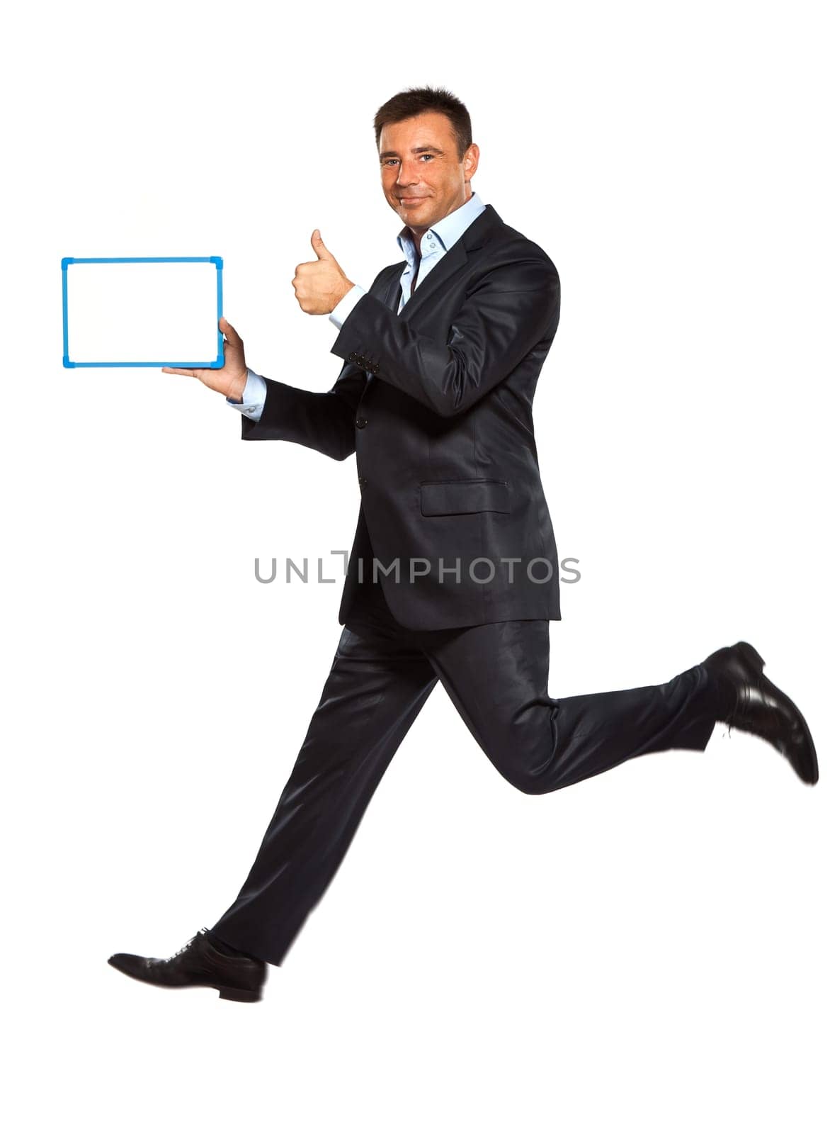 one caucasian business man running jumping double thumbs up holding whiteboard in studio isolated on white background