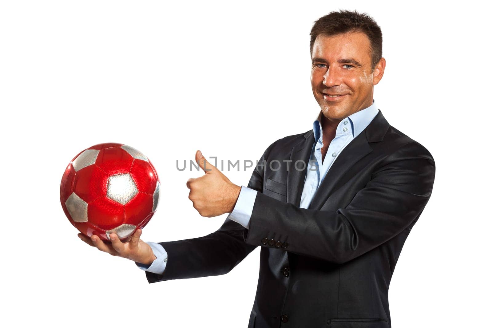 one caucasian business man holding showing soccer ball in studio isolated on white background