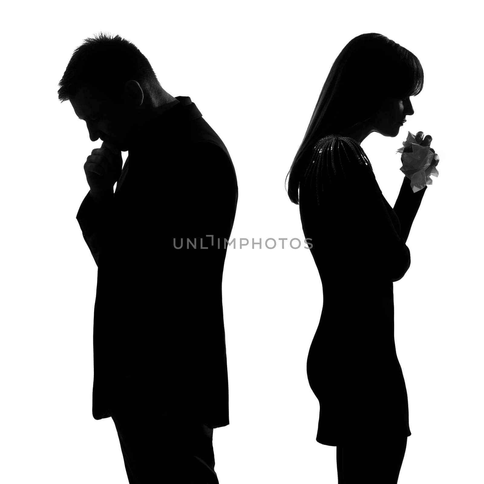 one caucasian sad couple back to back man thinking and woman crying standing back to back man and woman in studio silhouette isolated on white background