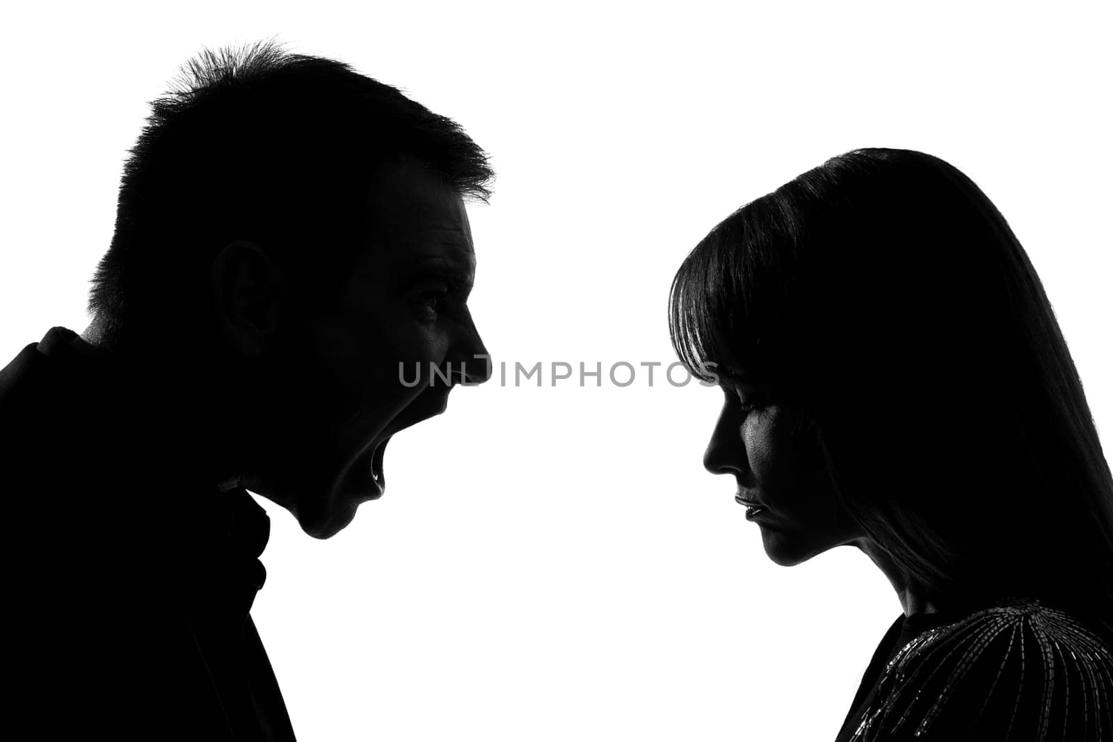 one caucasian couple man and woman face to face screaming shouting dipute in studio silhouette isolated on white background
