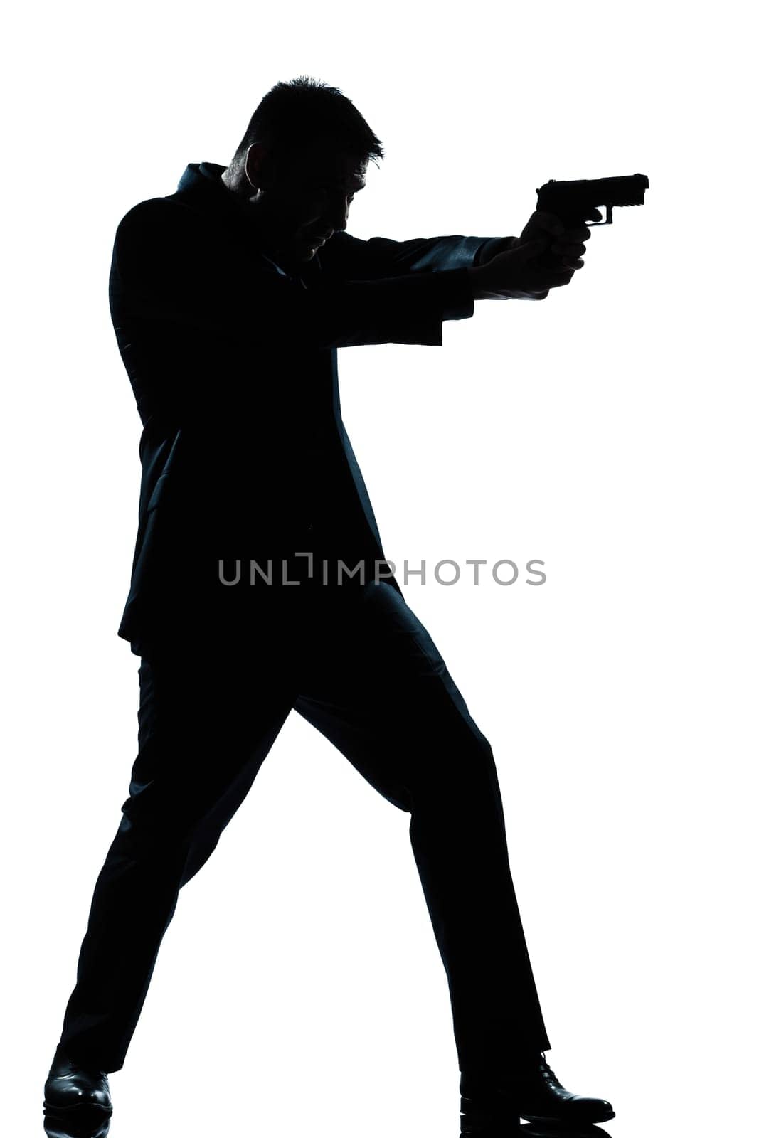 one caucasian spy criminal policeman detective man aiming shooting gun  full length silhouette in studio isolated white background