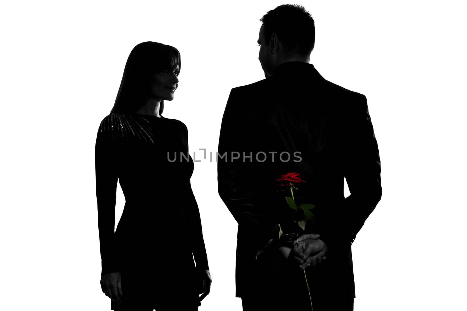 one caucasian couple man and woman smiling in studio silhouette isolated on white background