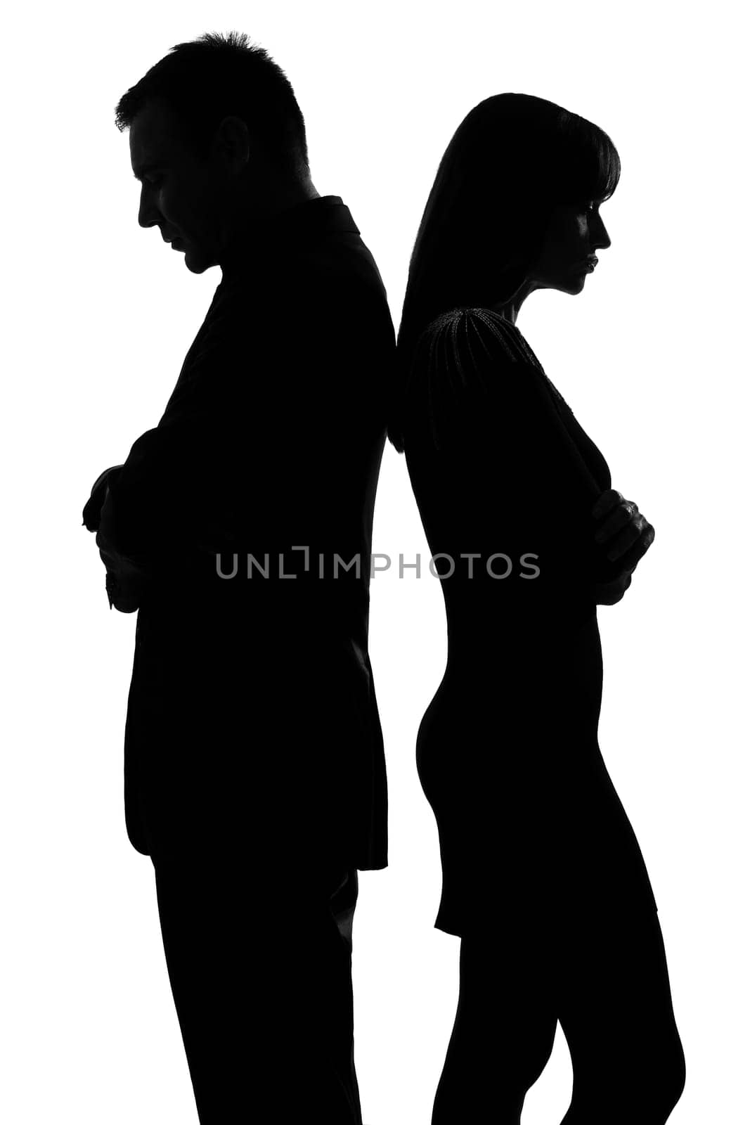 one caucasian couple standing back to back man and woman sad in studio silhouette isolated on white background
