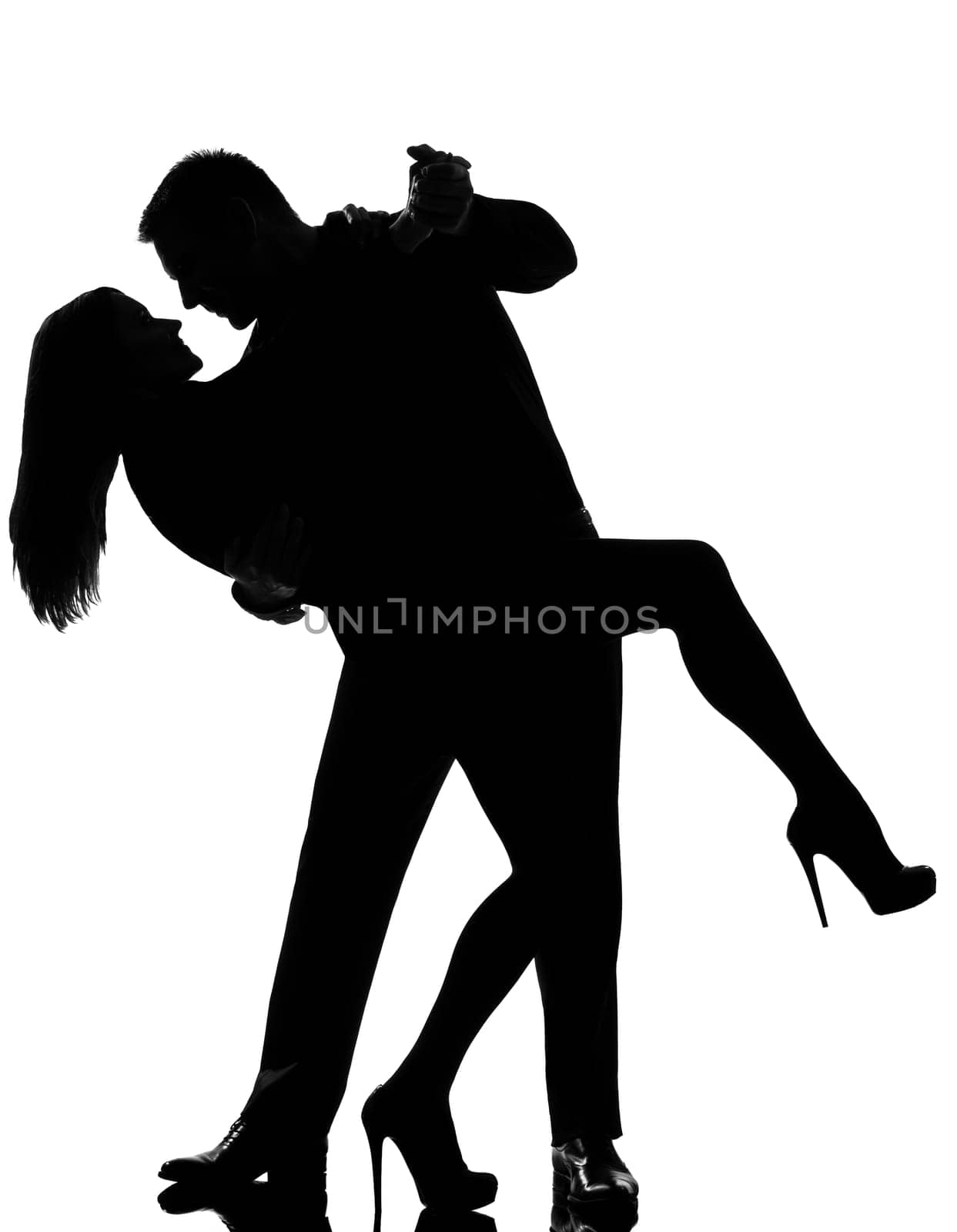 one caucasian couple lovers  man and woman dancing tango in studio silhouette isolated on white background