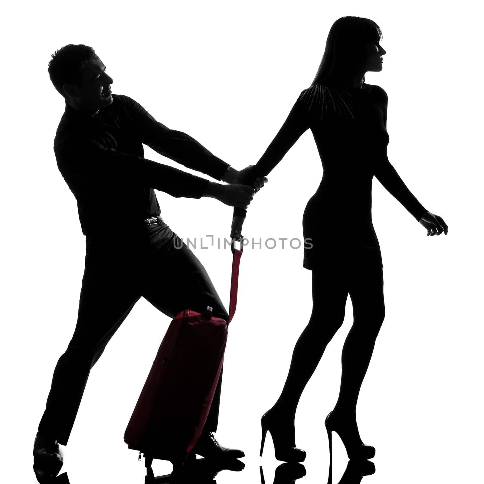 one caucasian couple dispute separation woman leaving and man holding back in studio silhouette isolated on white background