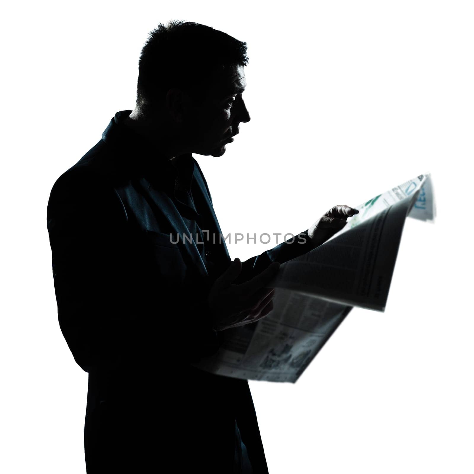 one caucasian man portrait silhouette reading newspaper in studio isolated on white background