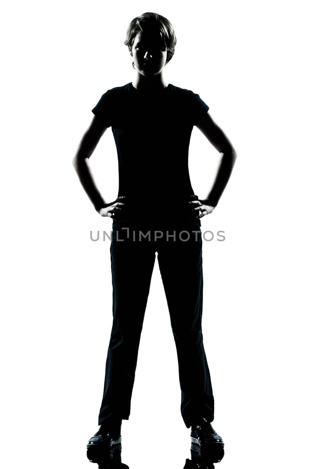 one caucasian young teenager silhouette boy or girl standing hands on hips full length in studio cut out isolated on white background