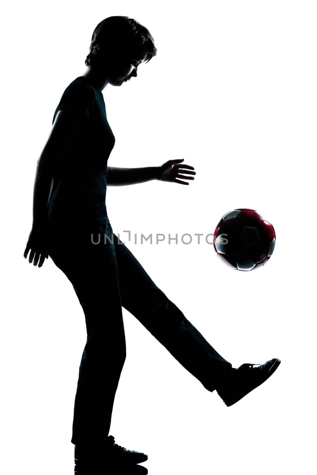 one caucasian young teenager silhouette  girl  juggling soccer football full length in studio cut out isolated on white background
