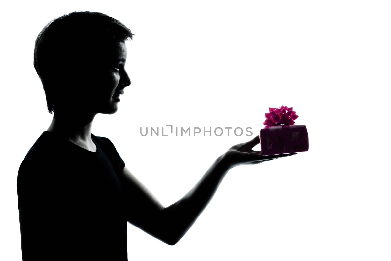 one caucasian young teenager silhouette boy or girl offering present gift  portrait in studio cut out isolated on white background
