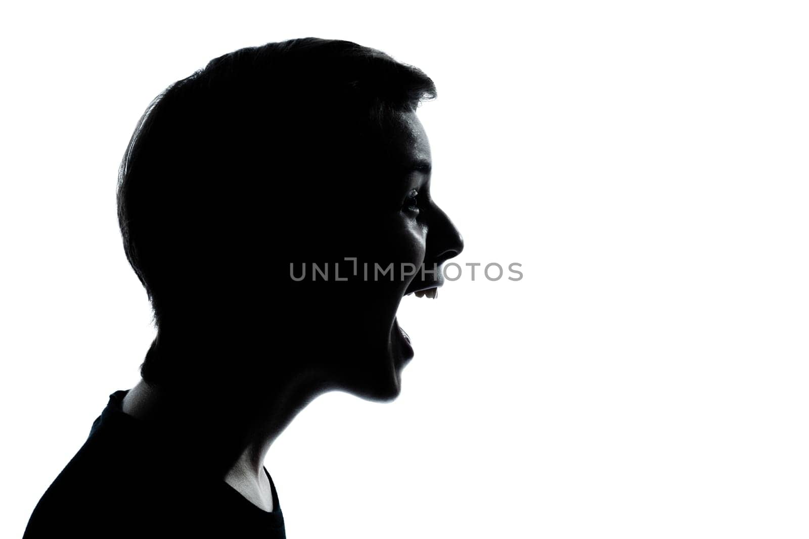 one caucasian young teenager silhouette boy or girl laughing portrait in studio cut out isolated on white background