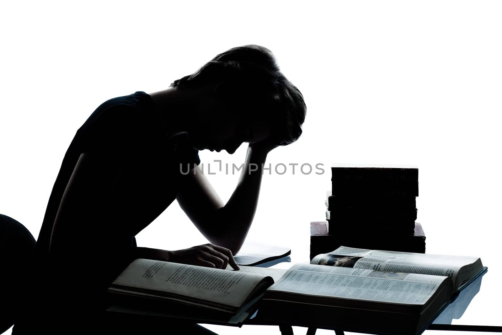 one caucasian young teenager silhouette boy girl studying tired reading books in studio cut out isolated on white background