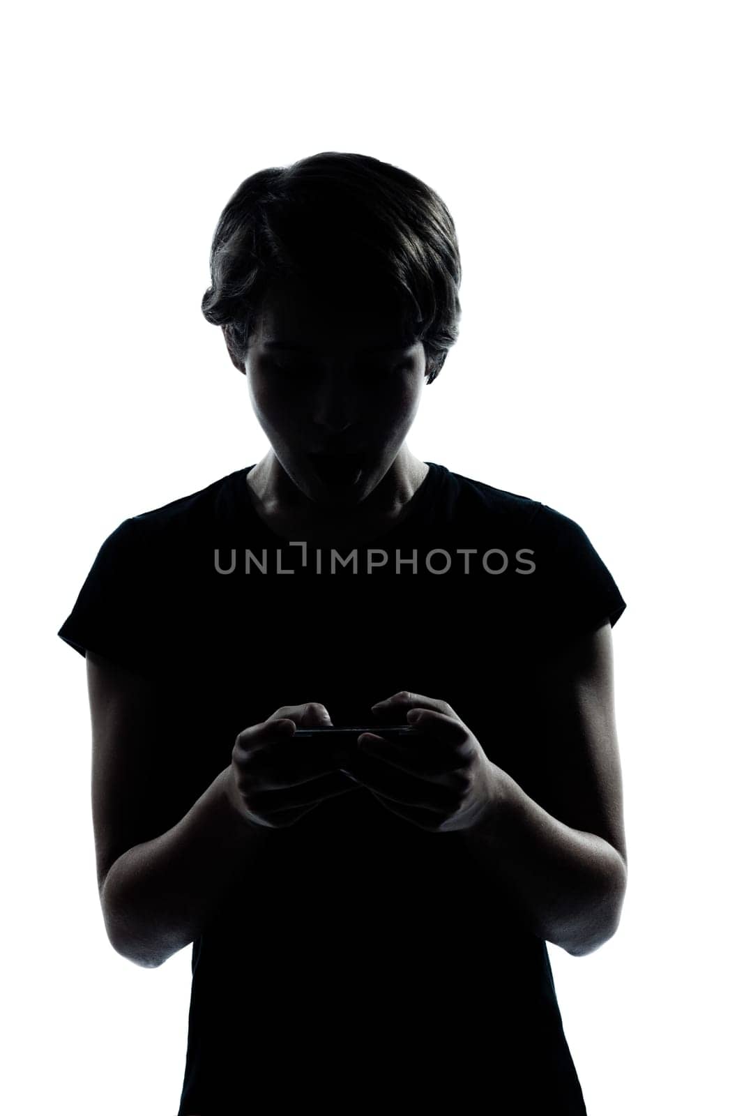 one caucasian young teenager silhouette boy or girl telephone videophone video game  portrait in studio cut out isolated on white background