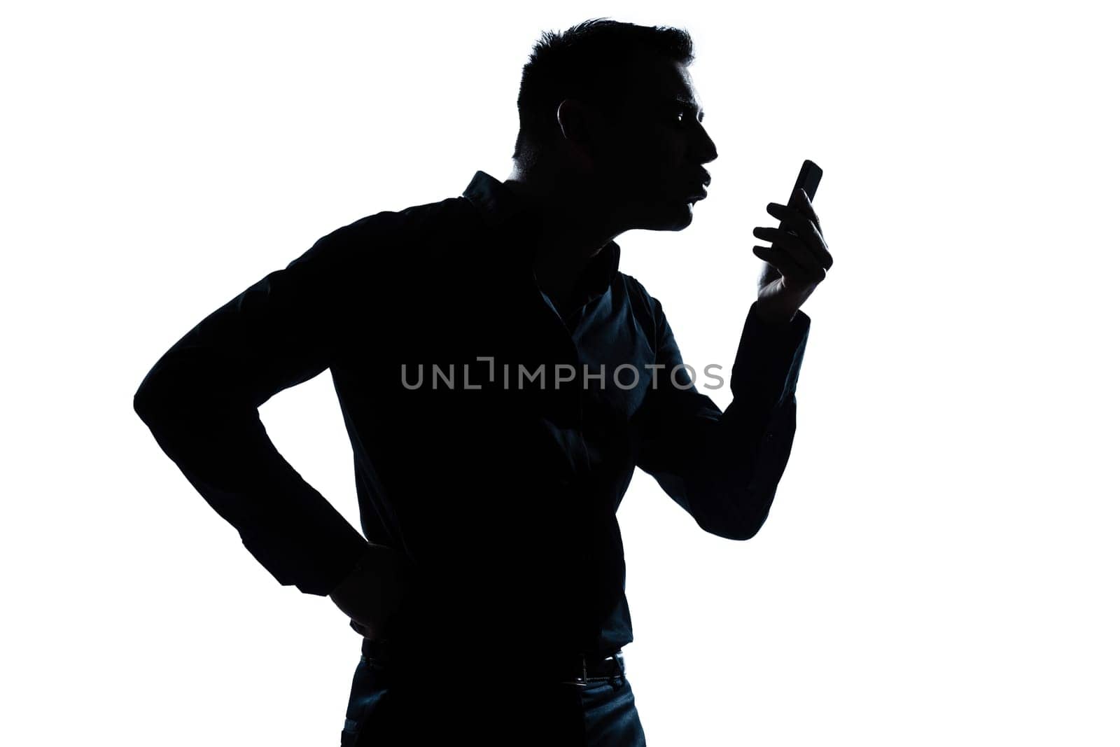 one caucasian man  telephone videophone  portrait silhouette in studio isolated white background