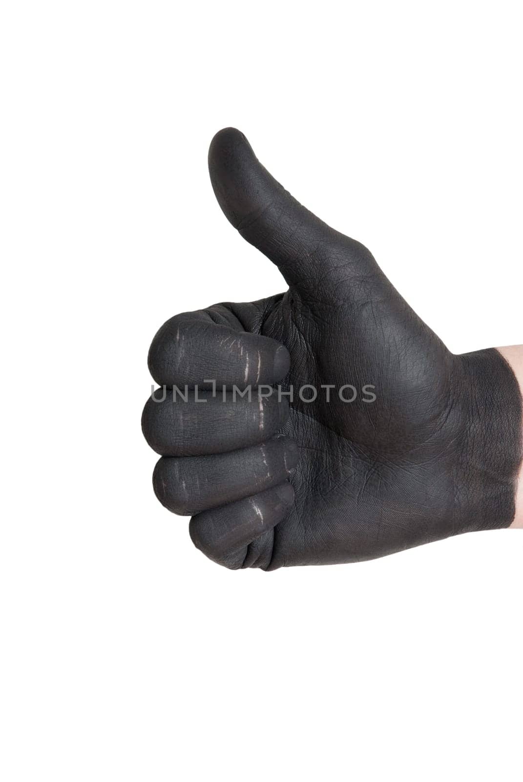 a black painted hand showing thumbs up gesture, isolated