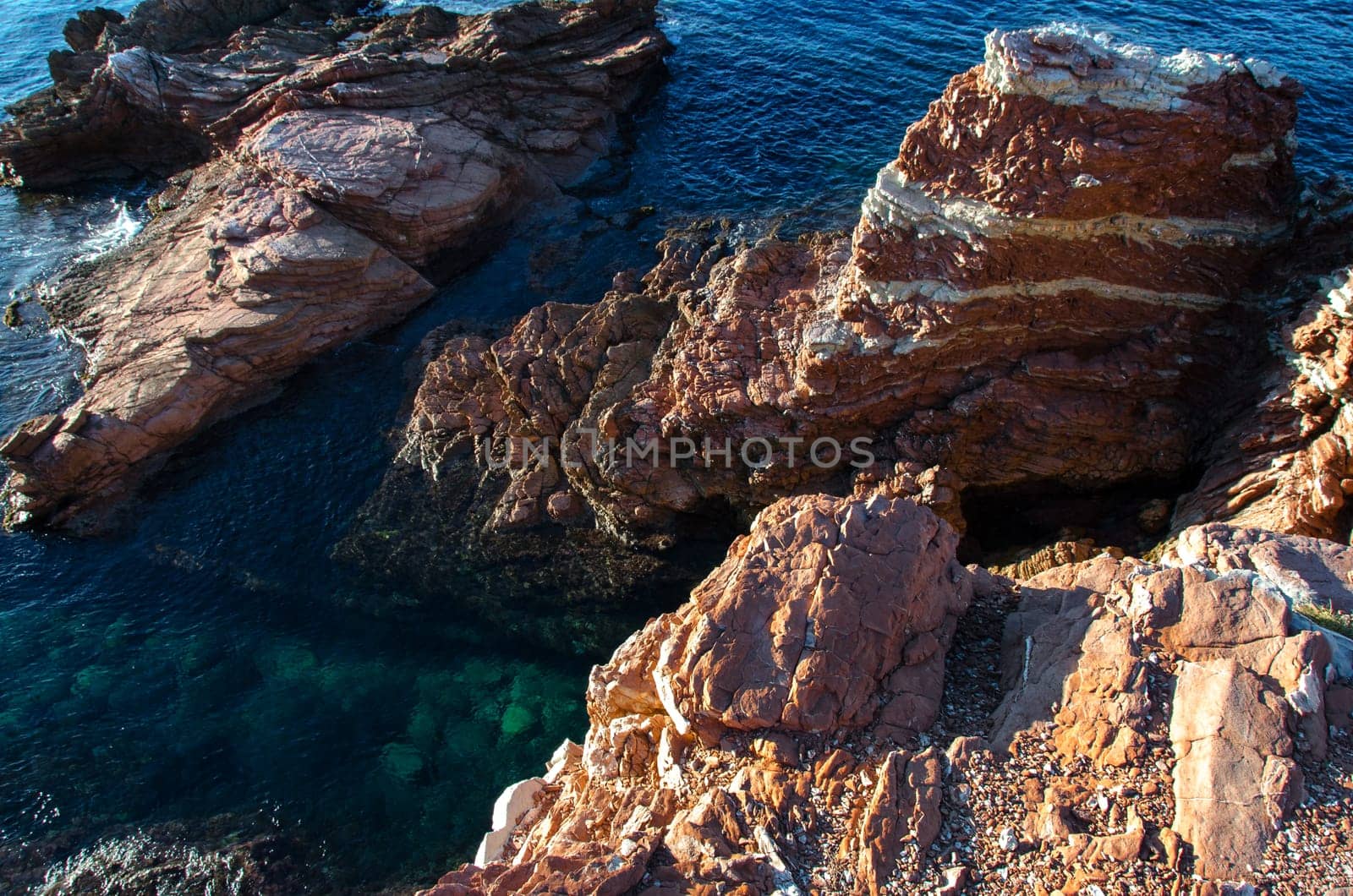 red rocks and blue sea in Terrasini in Palermo, Sicily
