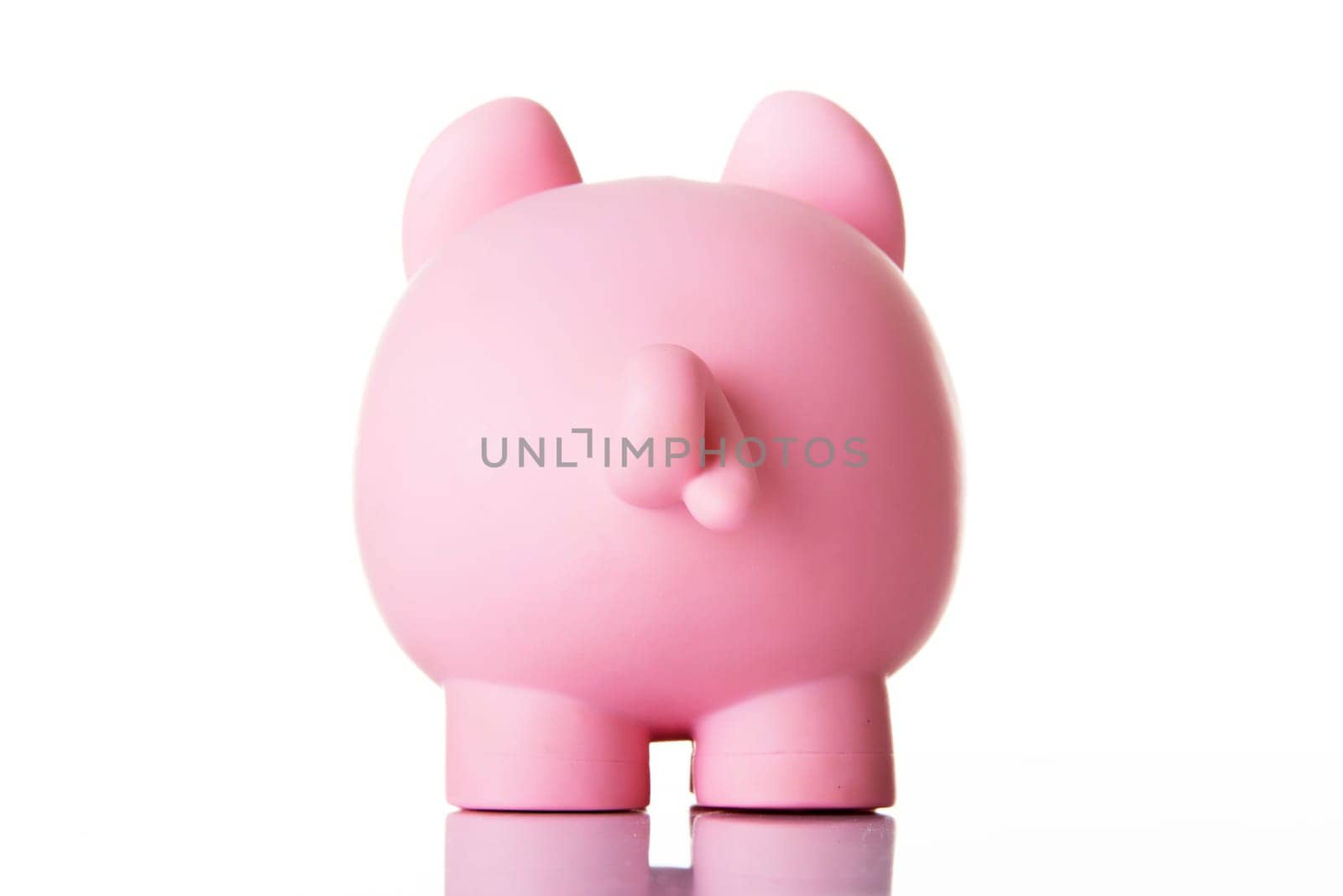 Piggy bank back. Isolated on white.
