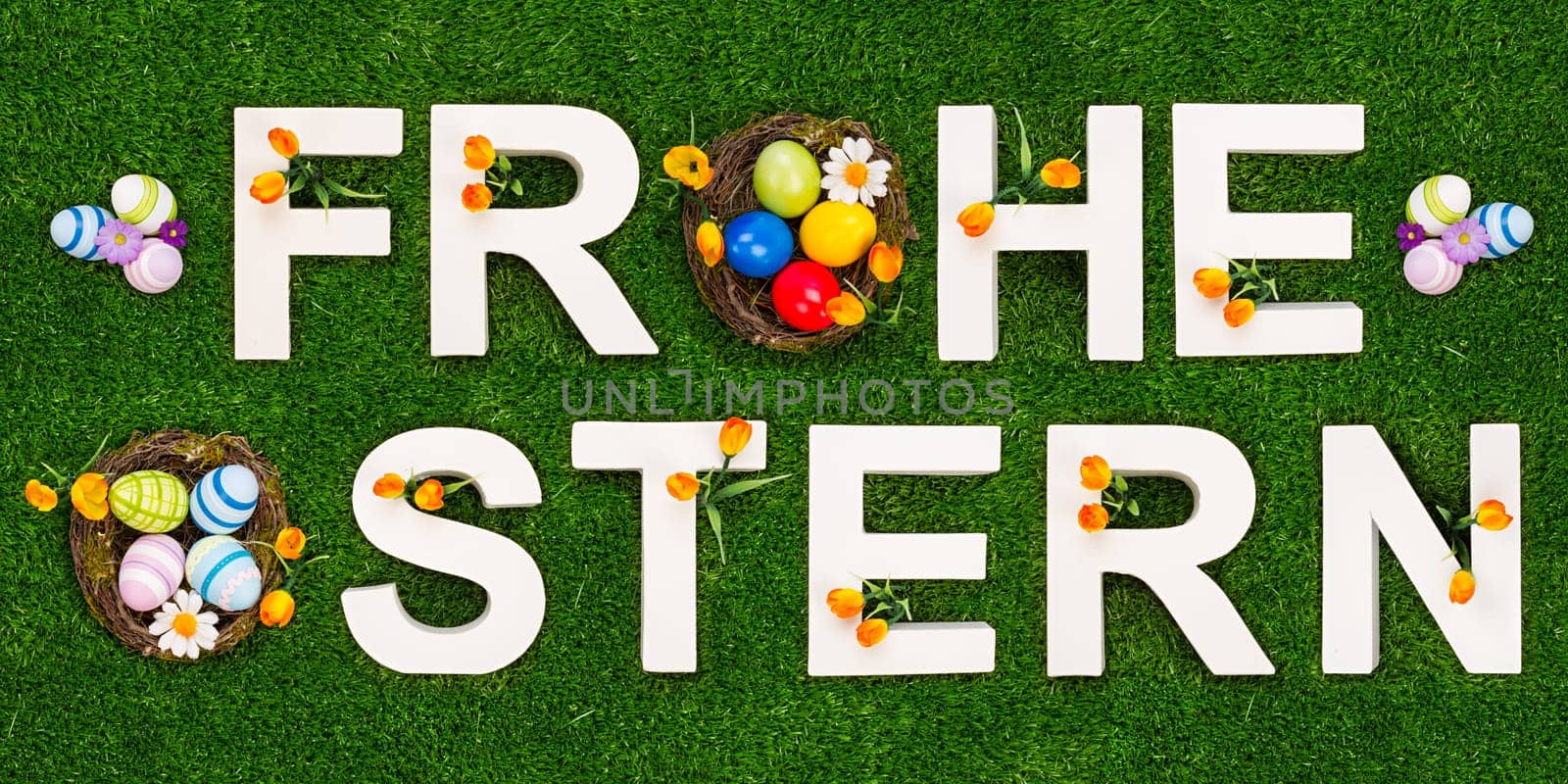 Happy Easter lettering on a green meadow