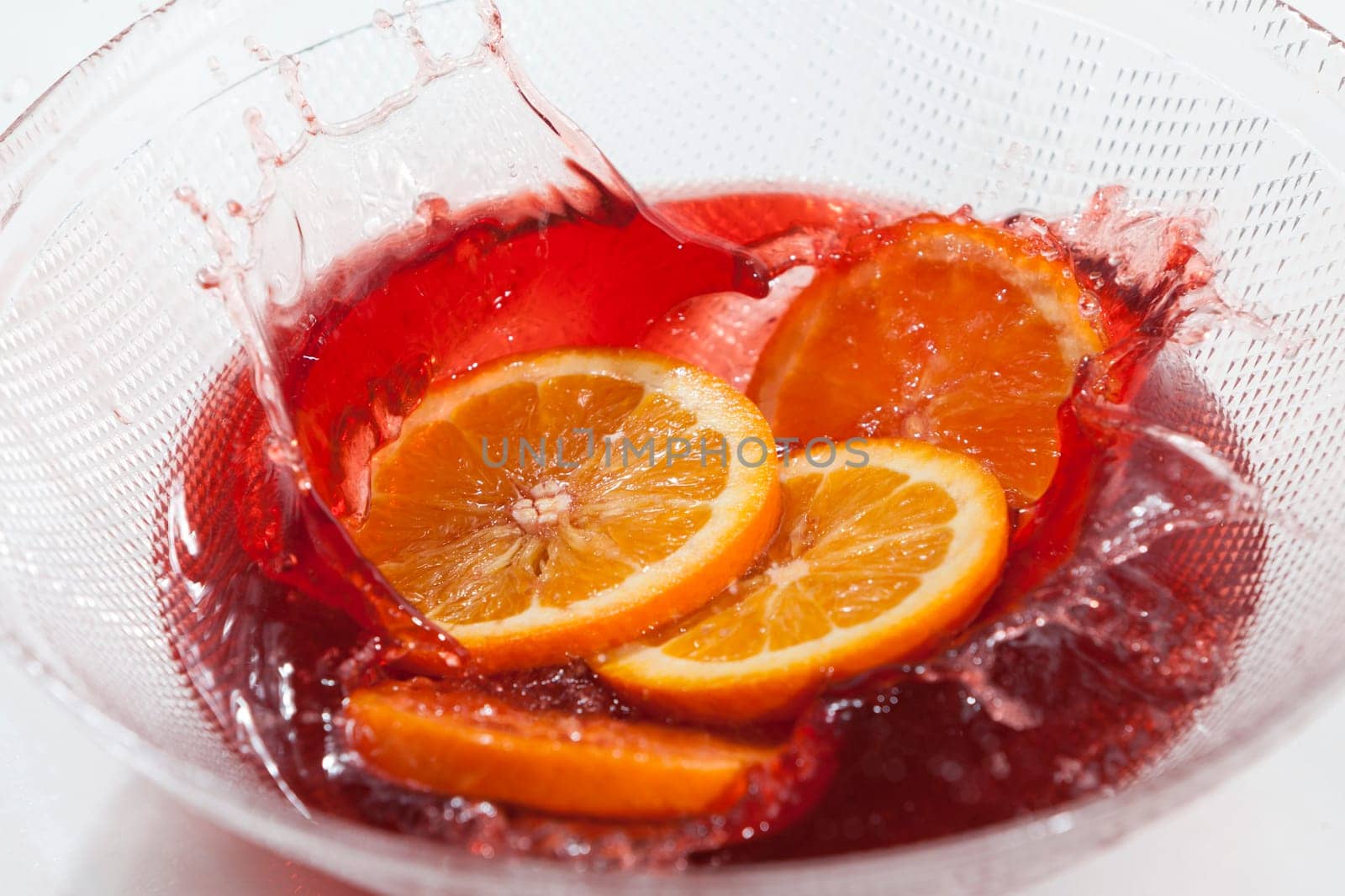 Orange slices splash in orange juice