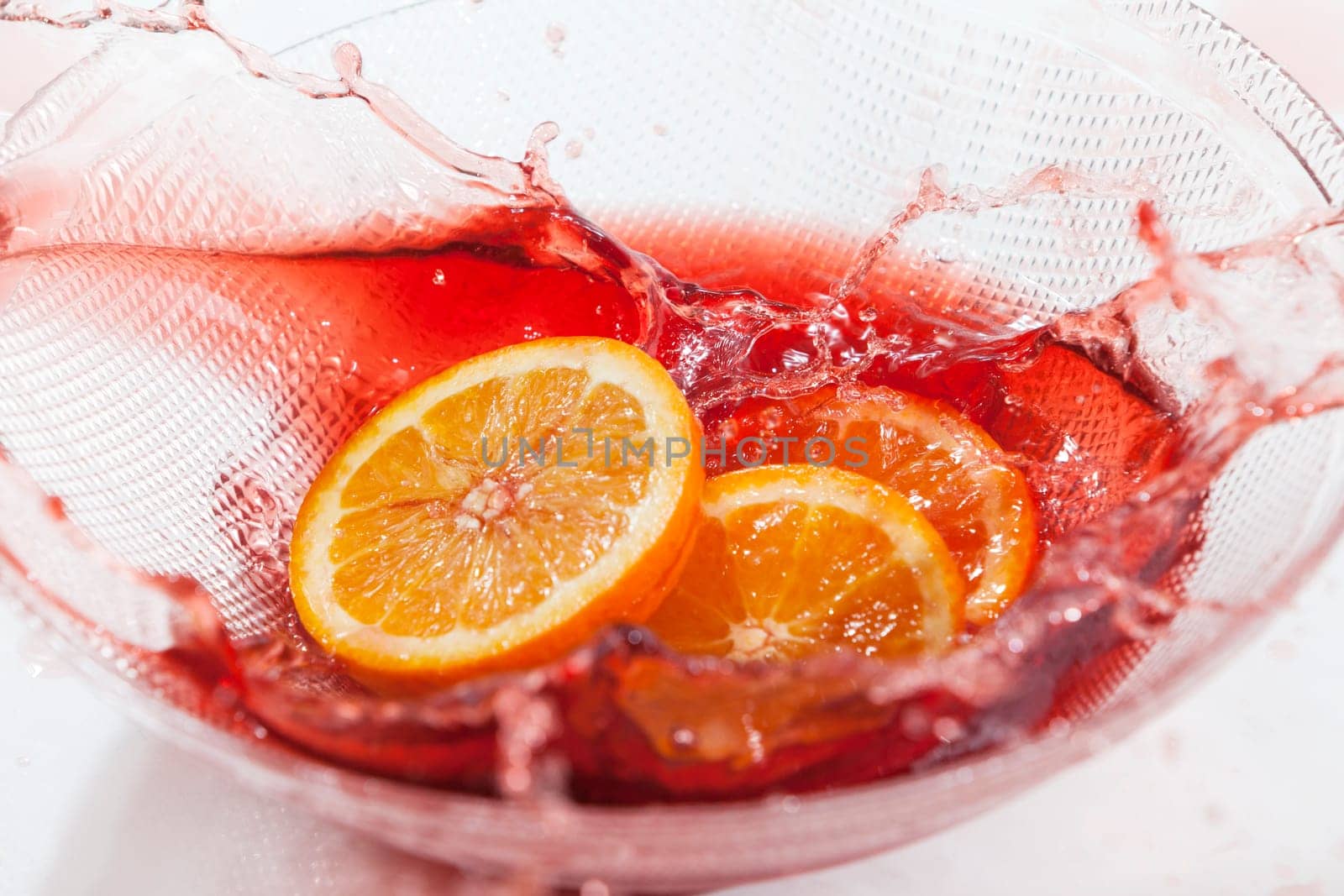 Orange slices splash in orange juice