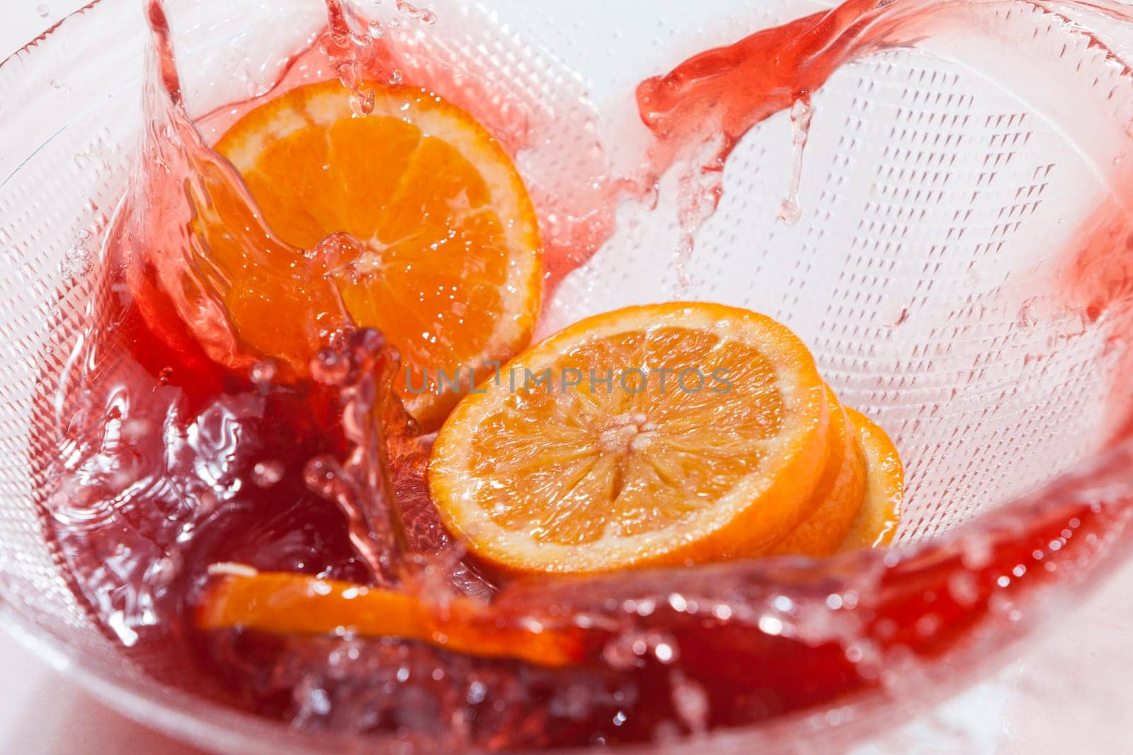 Orange slices splash in orange juice