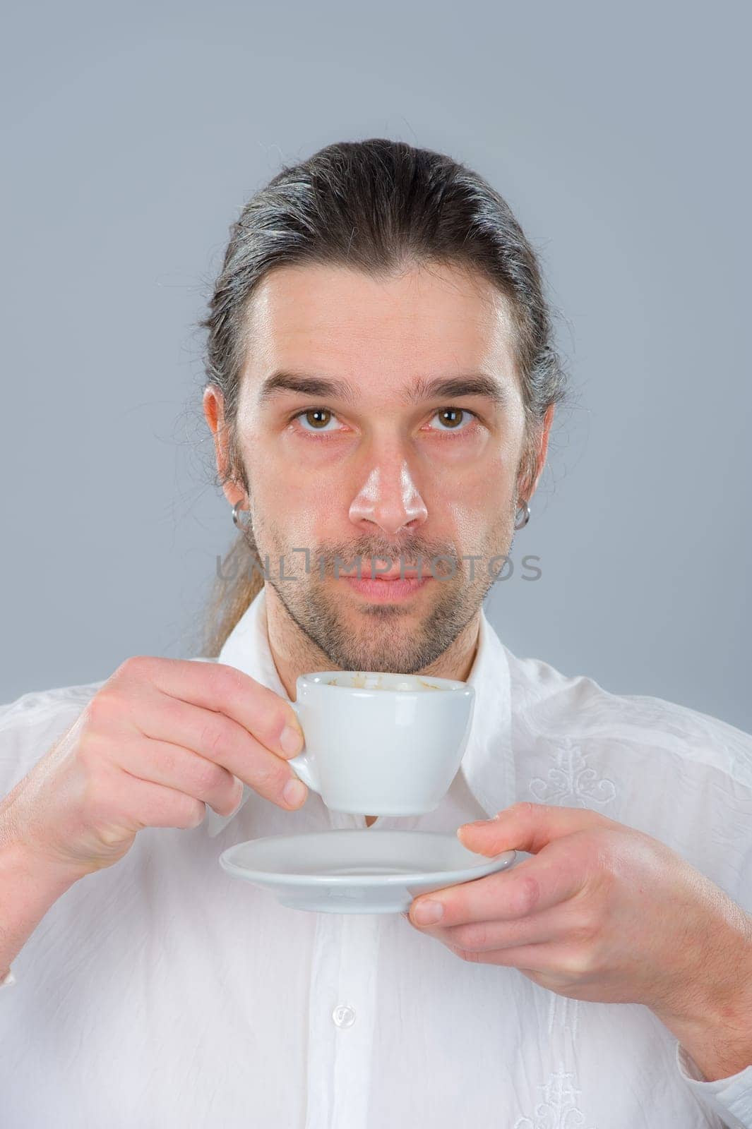 man is drinking coffee