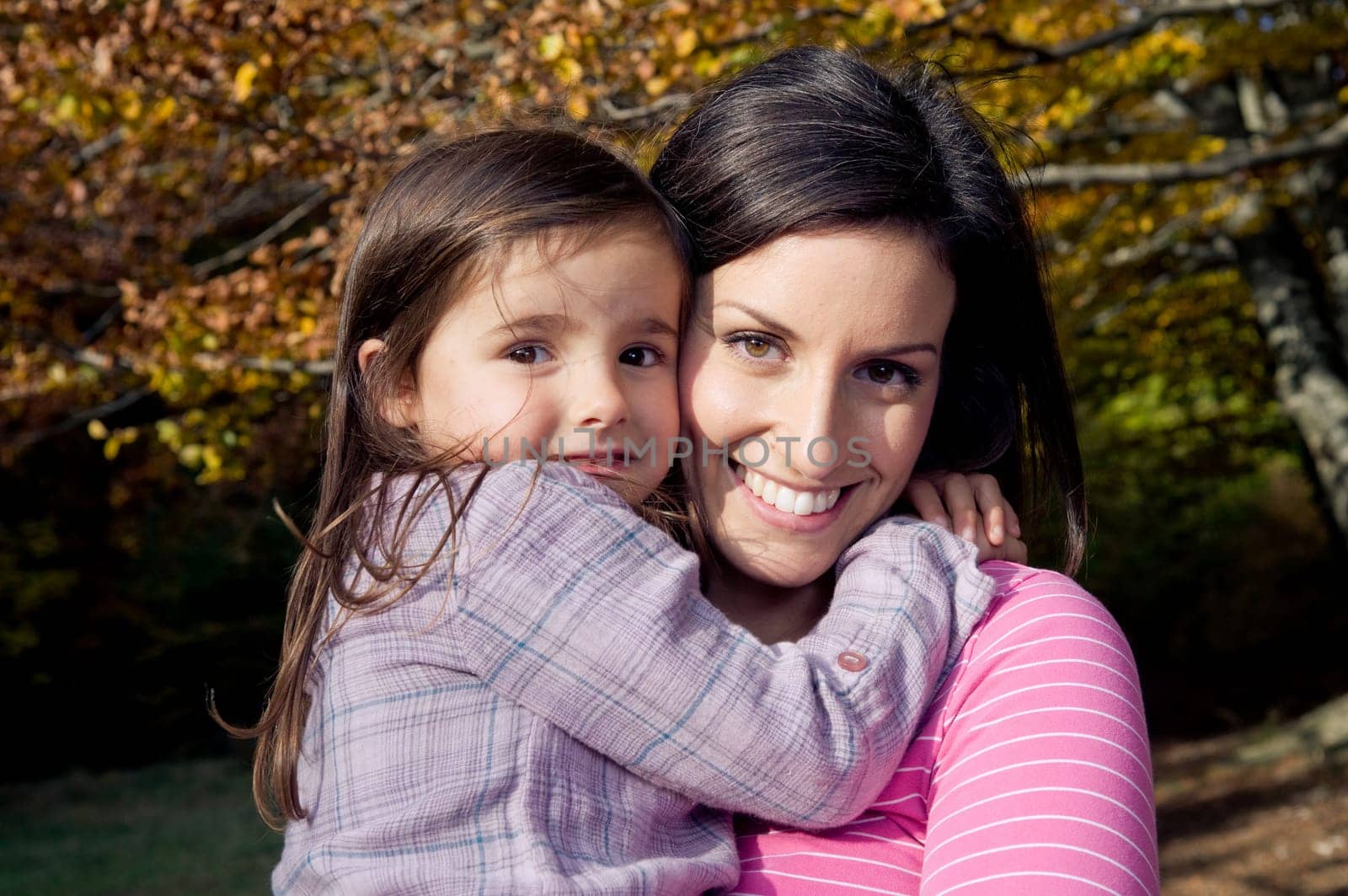 Mother and daughter outdoors on a autumn day