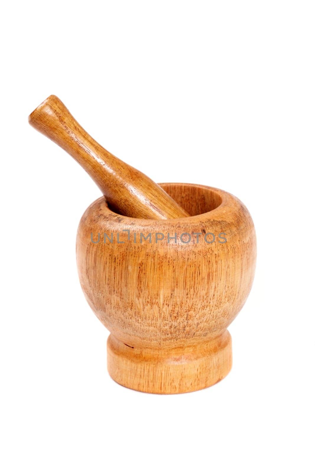 Wooden mortar with a pestle isolated on white