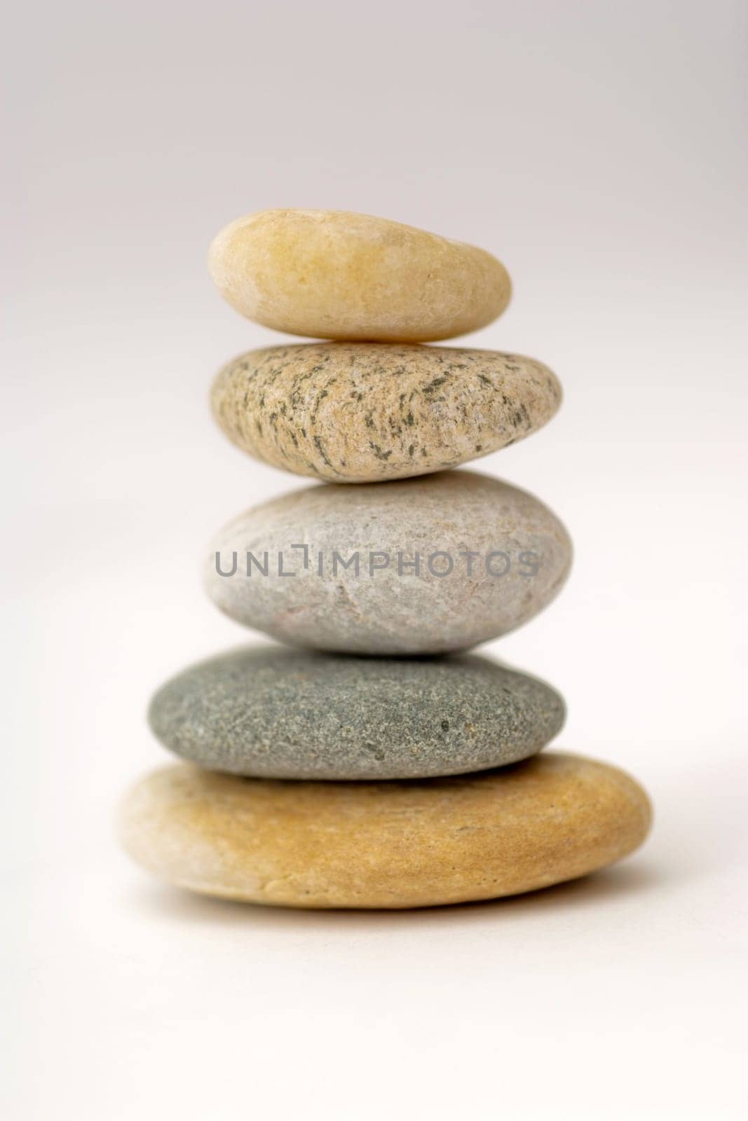 Stack of pebbles. Simple background.