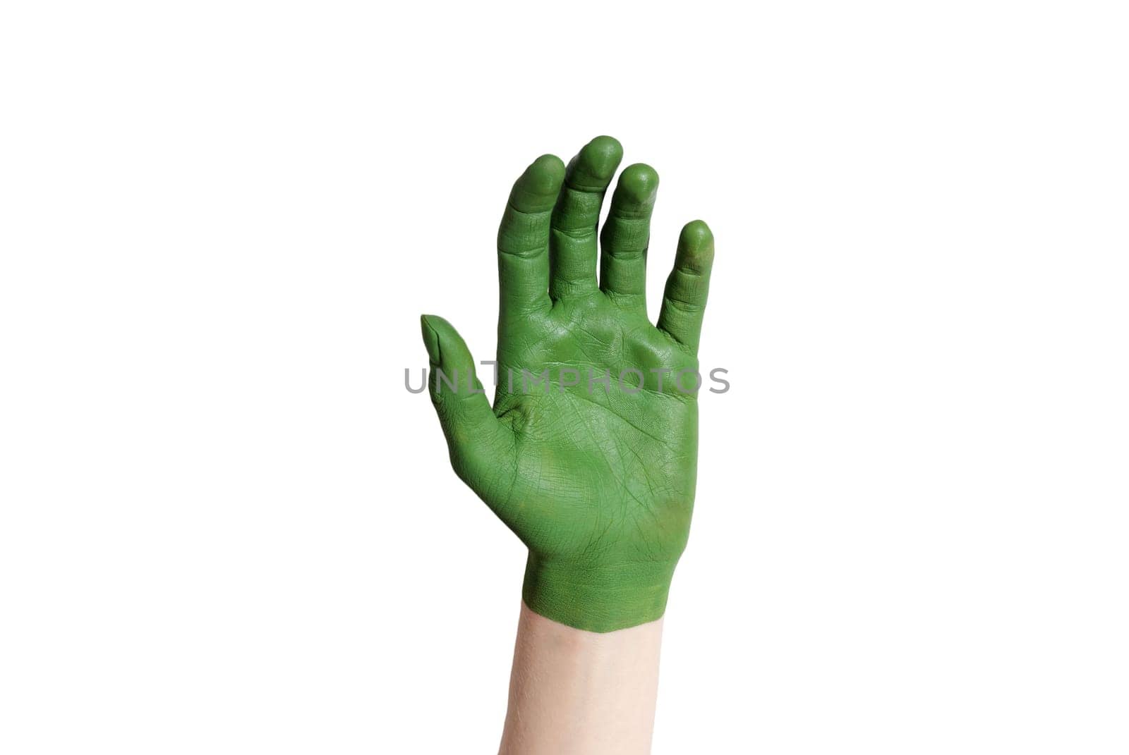a green painted hand in sickish gesture
