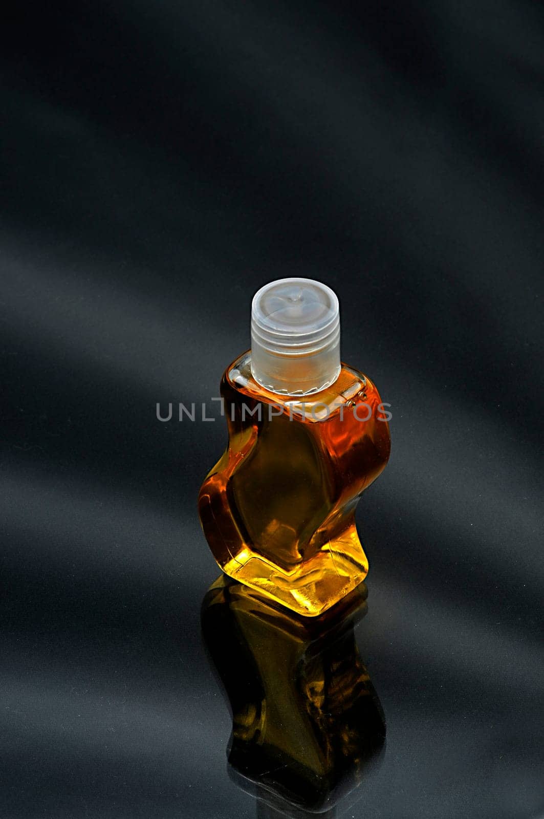 Yellow color shampoo on black shaded background