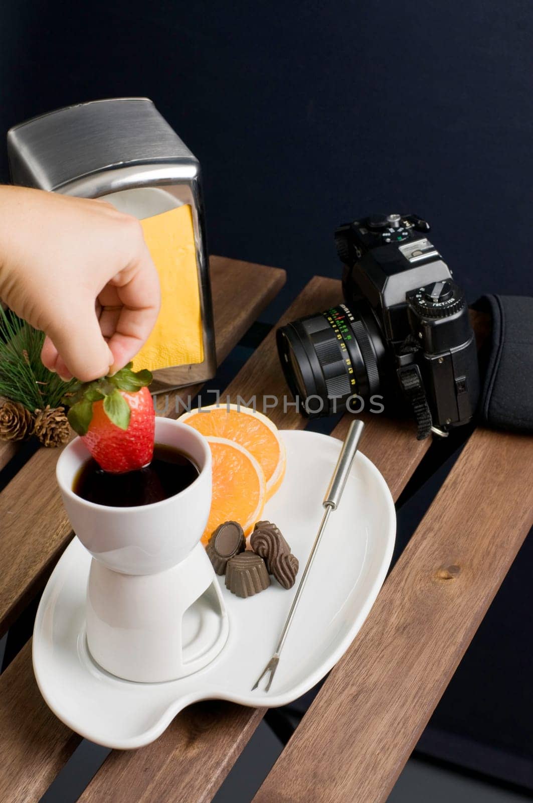 Dipping strawberry to hot fondue