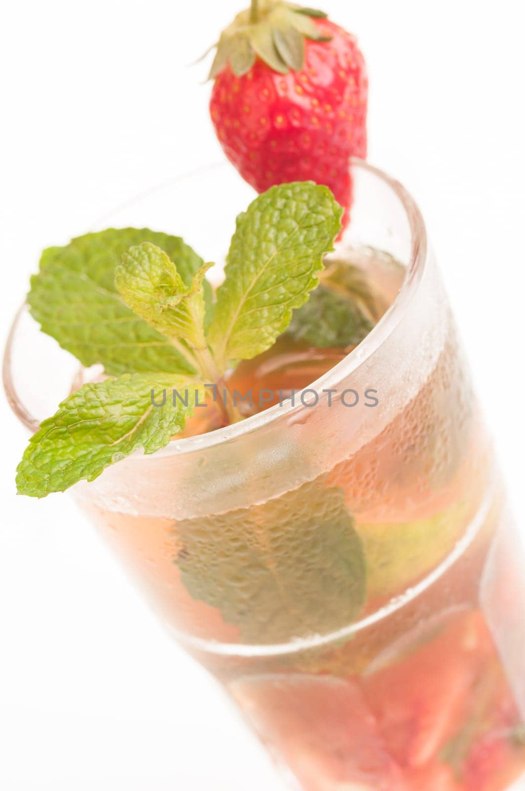 Mojito a Cuban cocktail made with cuban rum, lime, sugar , a splash of soda and flavoured with fresh strawberry juice