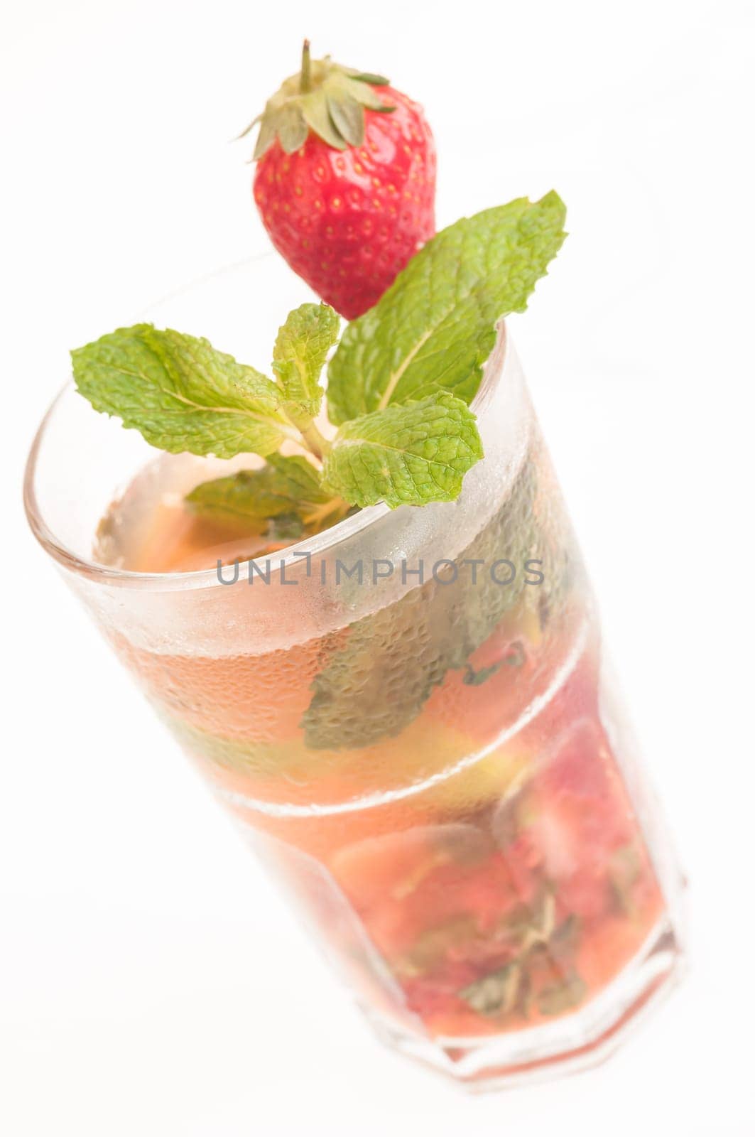 Mojito a Cuban cocktail made with cuban rum, lime, sugar , a splash of soda and flavoured with fresh strawberry juice