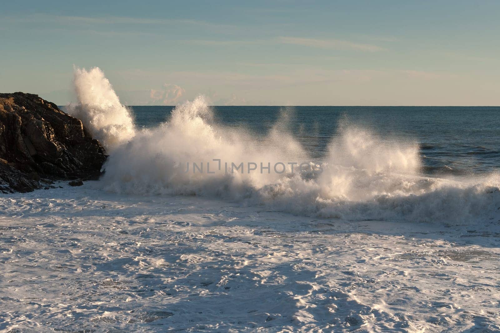 wave that breaks on the rocks of Fourth of thousand in Genoa