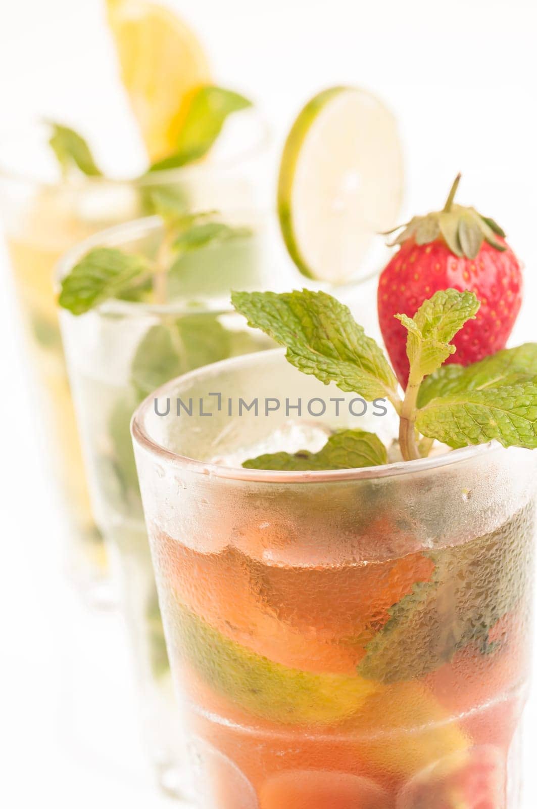 Mojito a Cuban cocktail made with cuban rum, lime, sugar , a splash of soda and flavoured with fresh fruit of your choice