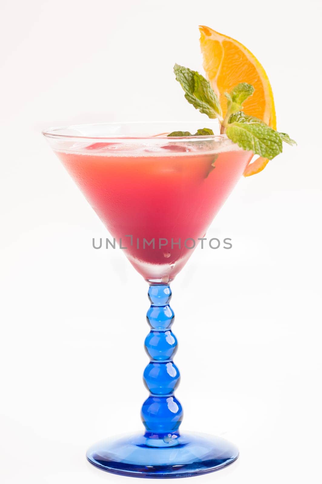 Tropical Fizz Champagne Cocktail made from cherry brandy, framboise, orange juice and topped up with Champagne