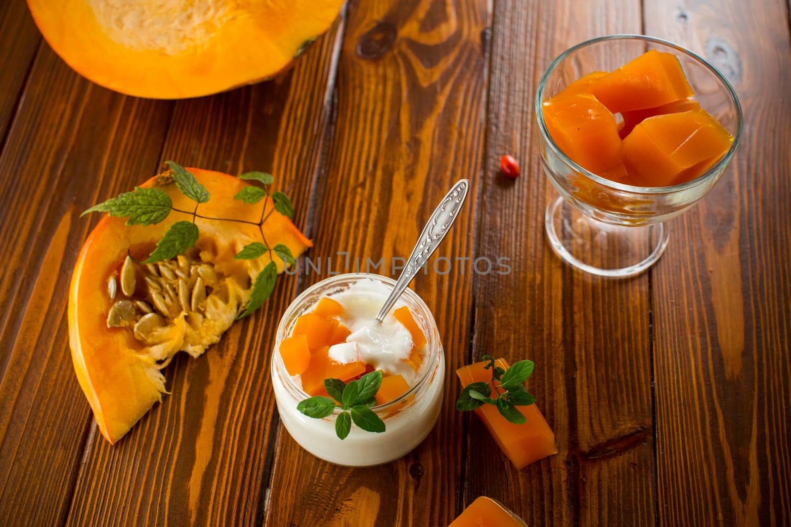 Homemade yogurt with pieces of pumpkin marmalade. Autumn recipes.