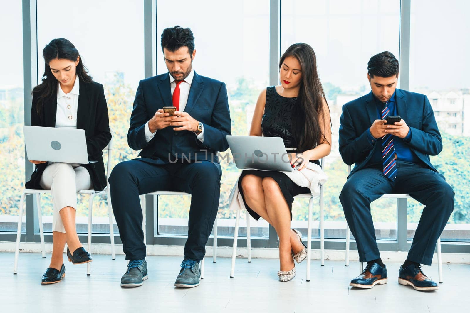 Job seekers and applicants waiting for interview on chairs in office. Job application and recruitment interview qualification concept. Jivy