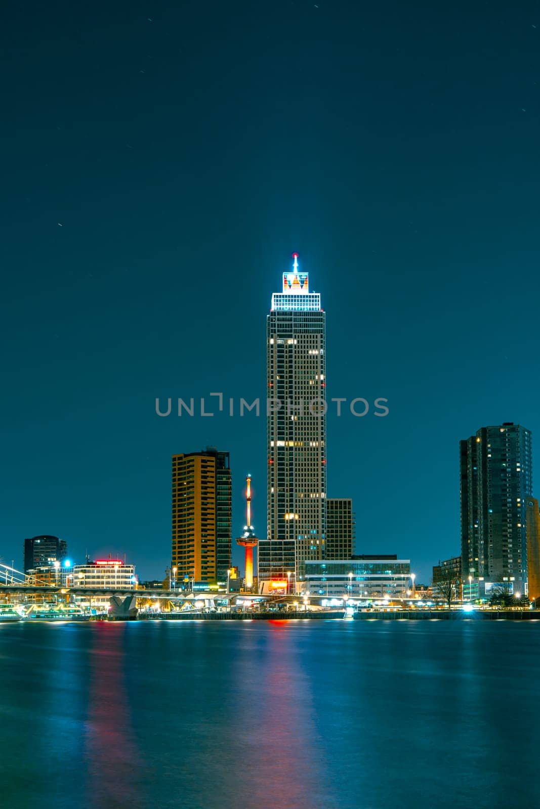 Spectacular Night View of Rotterdam from the Sea: Experience the Beauty of the City at Night.