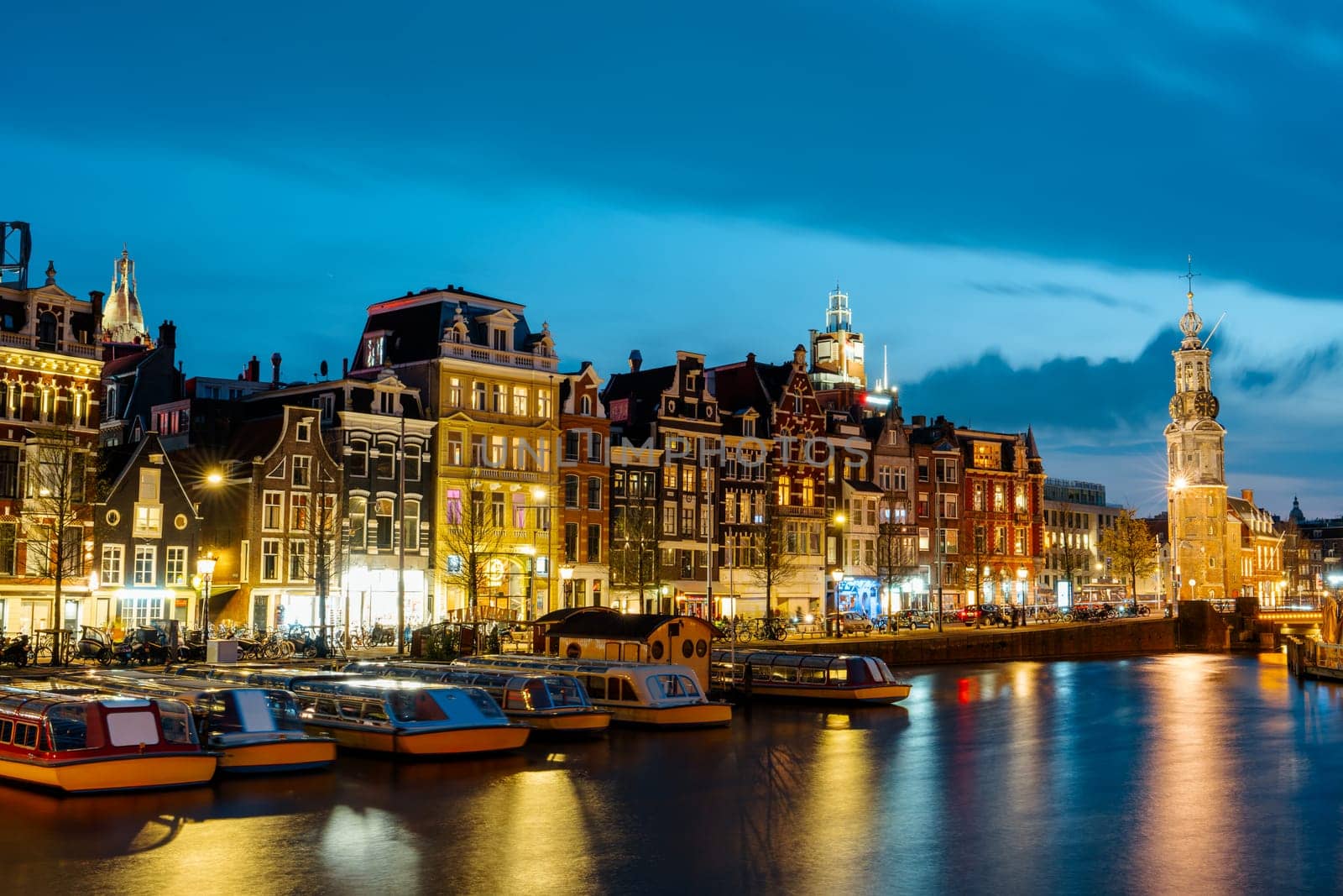 Captivating Night in Amsterdam: A Mesmerizing Long Exposure Photo of Amsterdam's Nighttime Canals by PhotoTime